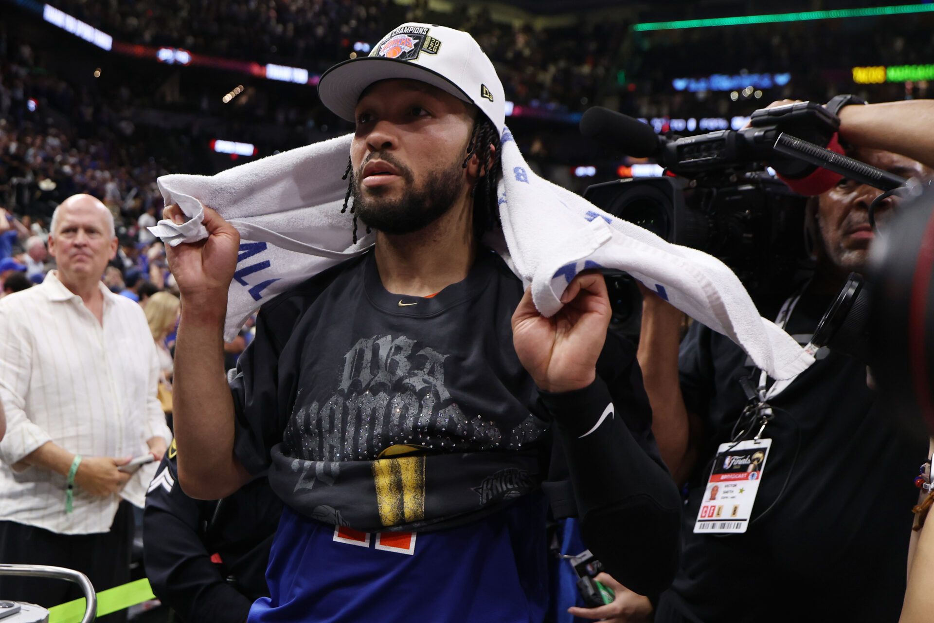 New York Knicks guard Jalen Brunson (11) stands at the end of the court prior to the championship trophy celebration after game five of the 2026 NBA Finals against the San Antonio Spurs at Frost Bank Center.