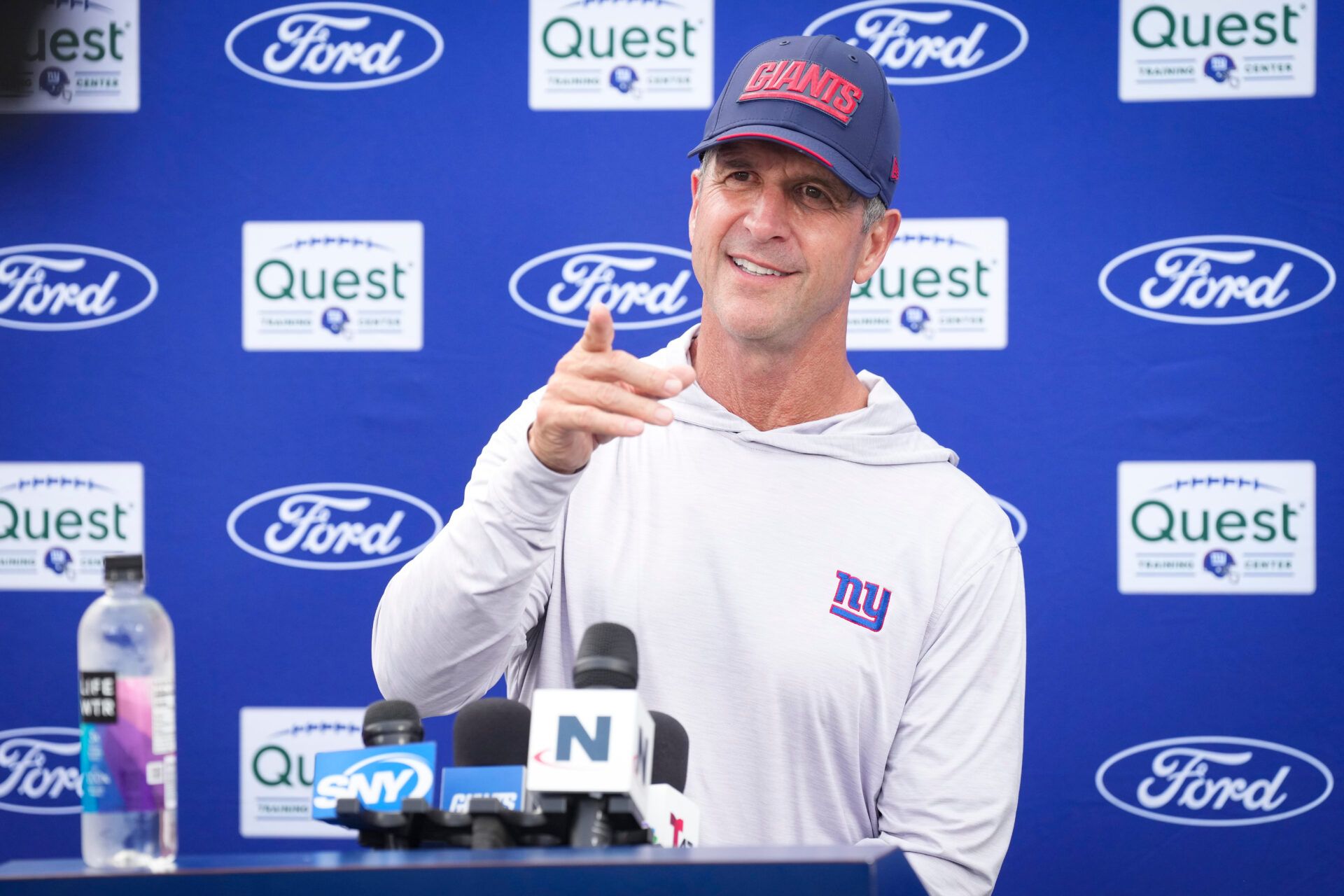 New York Giants head coach John Harbaugh points while speaking to members of the media after training camp at Quest Diagnostics Training Center, Aug 10, 2026, East Rutherford, NJ, USA.