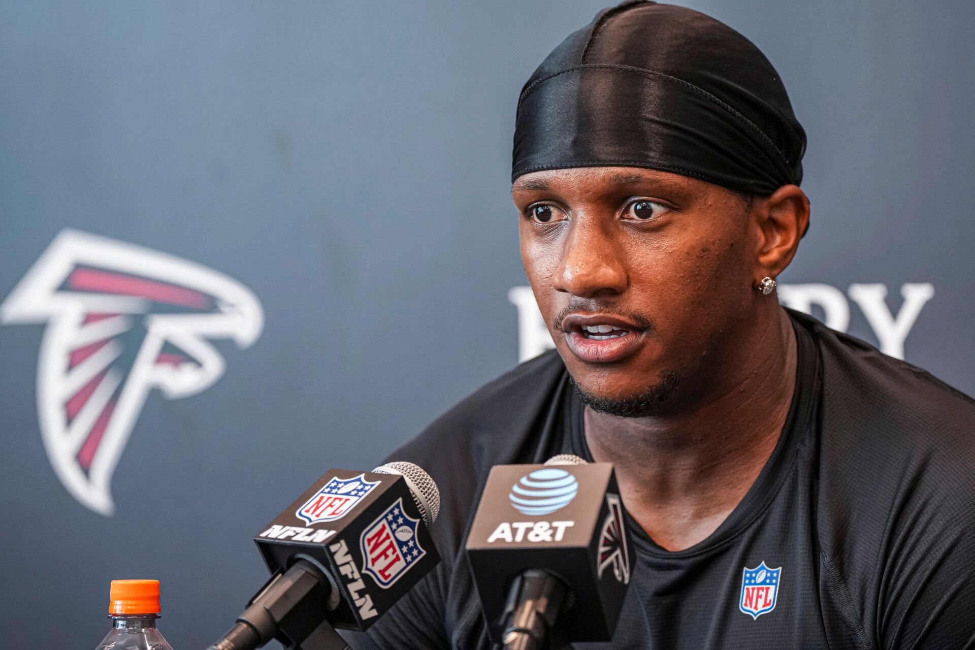 Atlanta Falcons quarterback Michael Penix Jr. (9) talks to the media during the first day of training camp at IBM Performance Field.