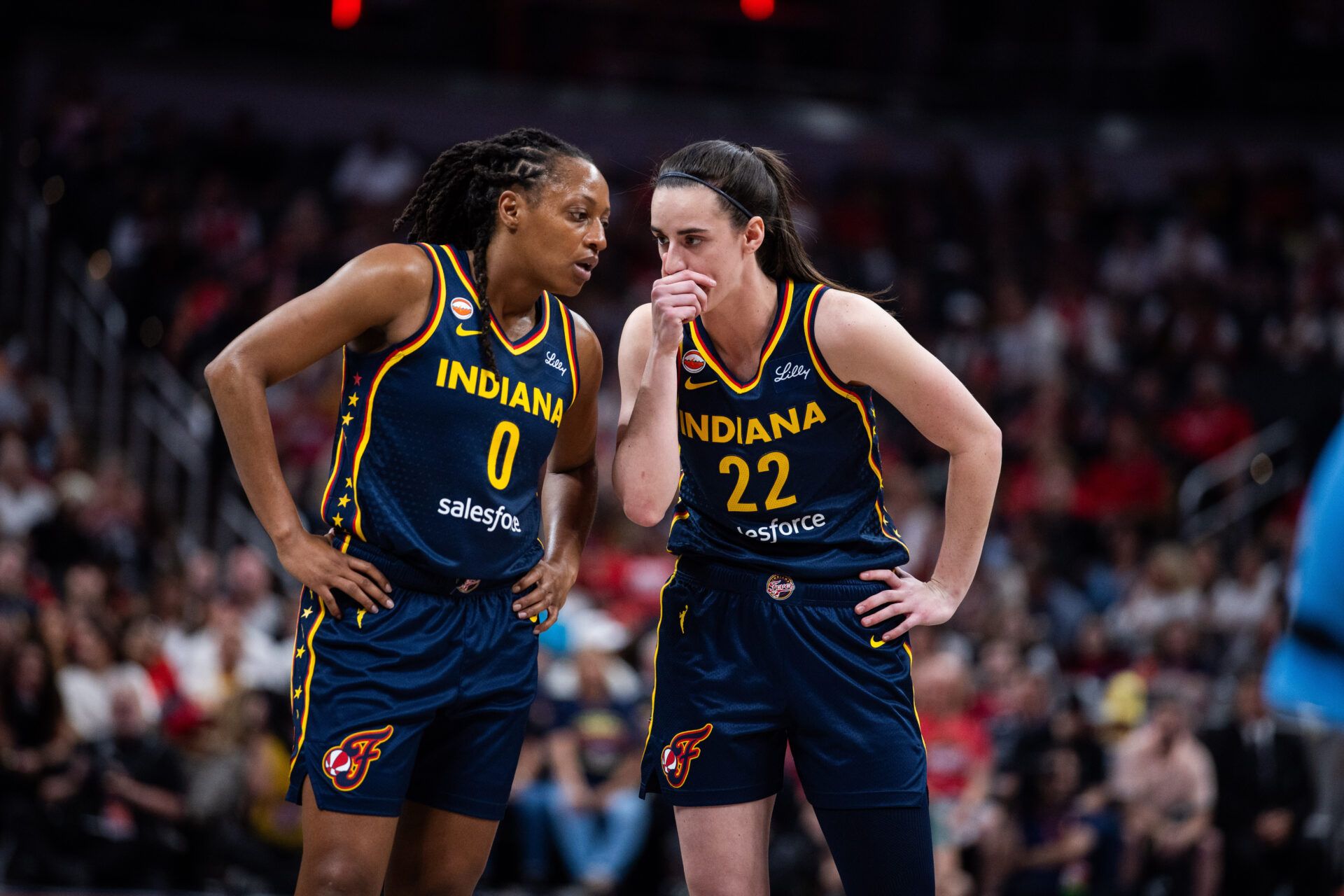 Indiana Fever guard Kelsey Mitchell (0) and guard Caitlin Clark (22) in the first half against the Chicago Sky at Gainbridge Fieldhouse.