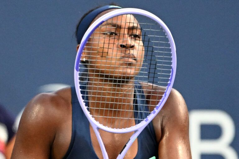 Coco Gauff (USA) looks through the strings of her racquet as she waits to receive serve from Maria Sakkari (GRE) during third round play at Sobeys Stadium.