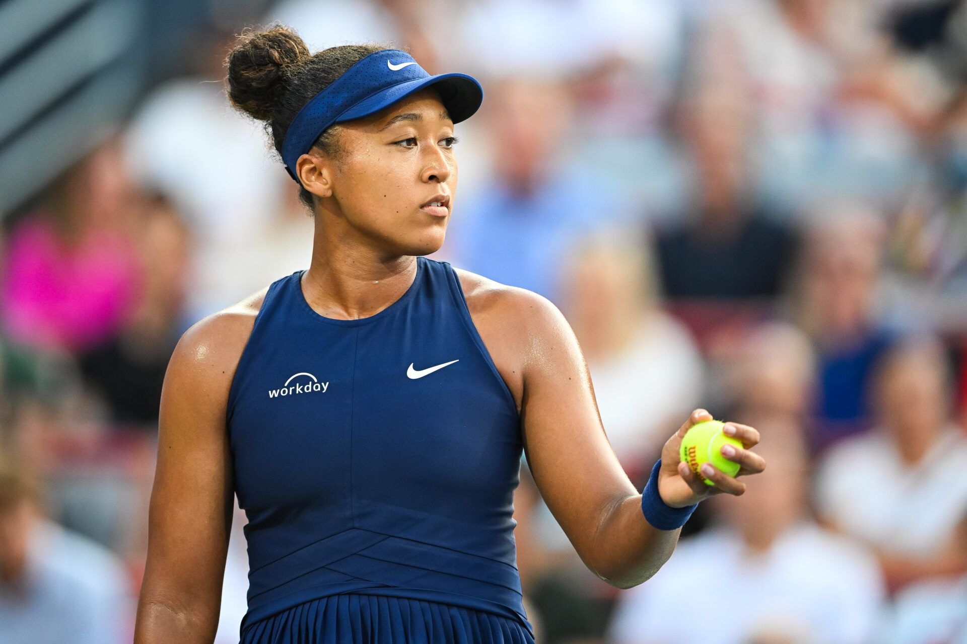 Naomi Osaka (JPN) serves the ball to Victoria Mboko (CAN) during singles final play at IGA Stadium.