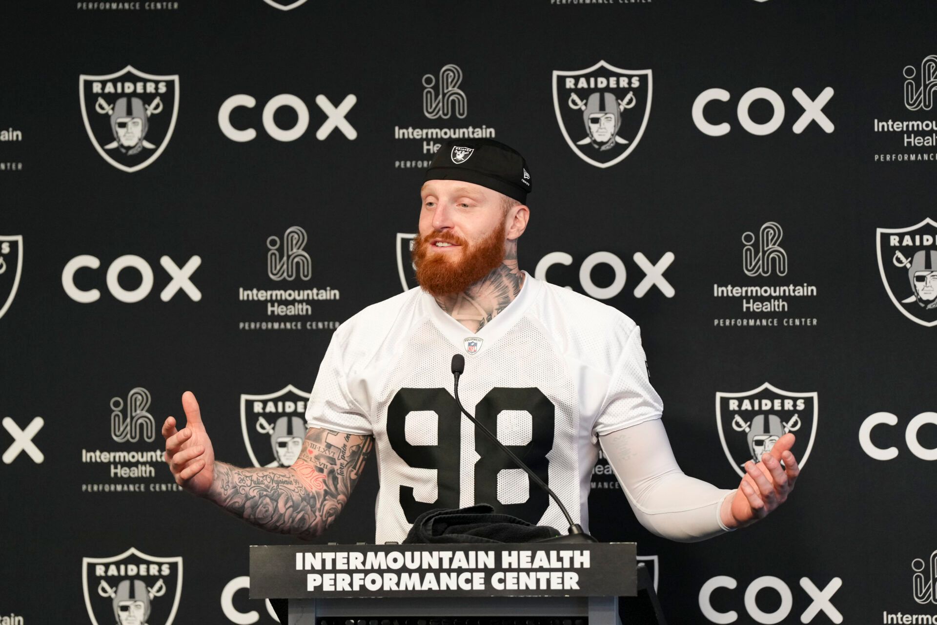 Las Vegas Raiders defensive end Maxx Crosby (98) speaks during a news conference during organized team activities at Intermountain Health Performance Center.