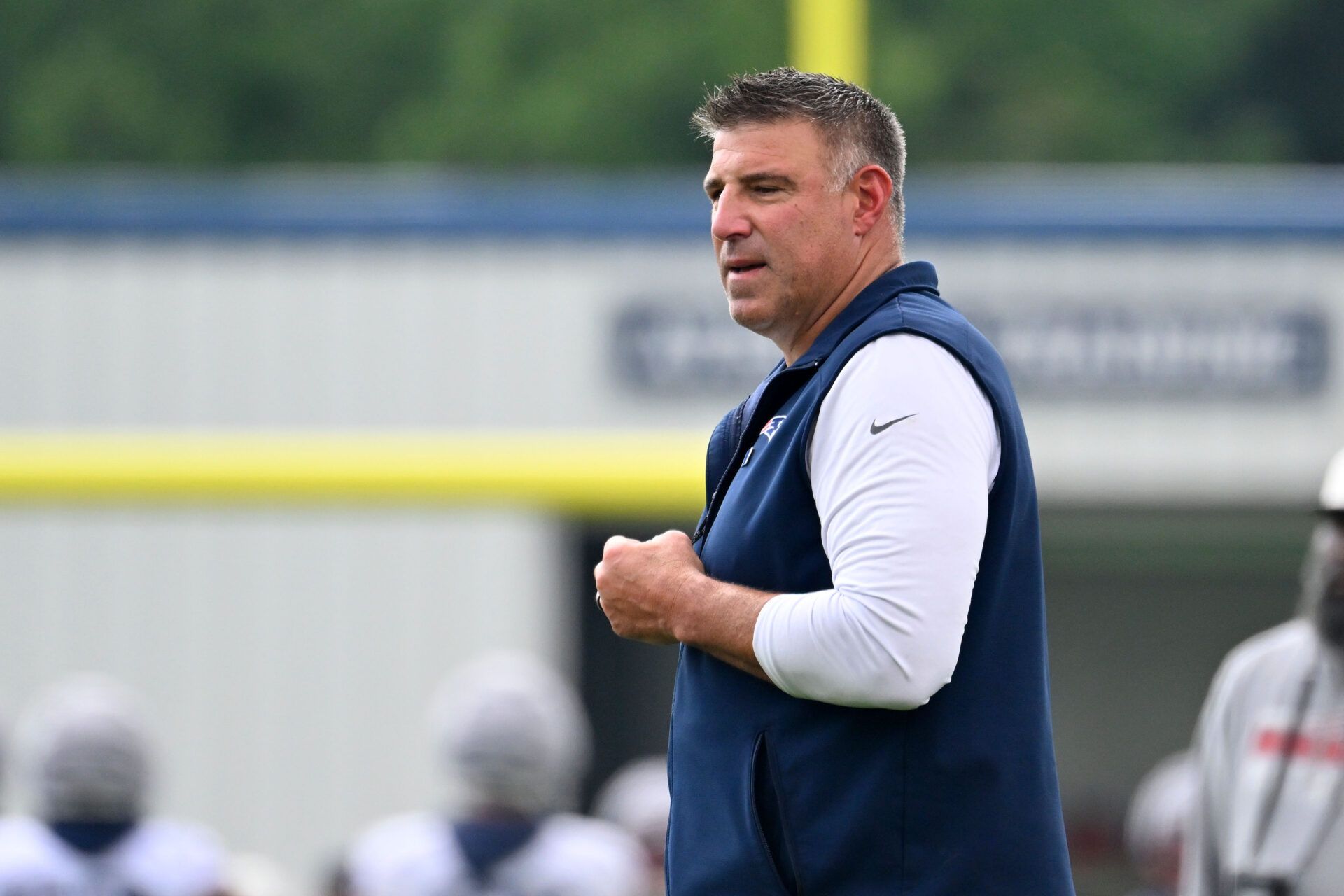 New England Patriots head coach Mike Vrabel watches over practice during training camp at Gillette Stadium.