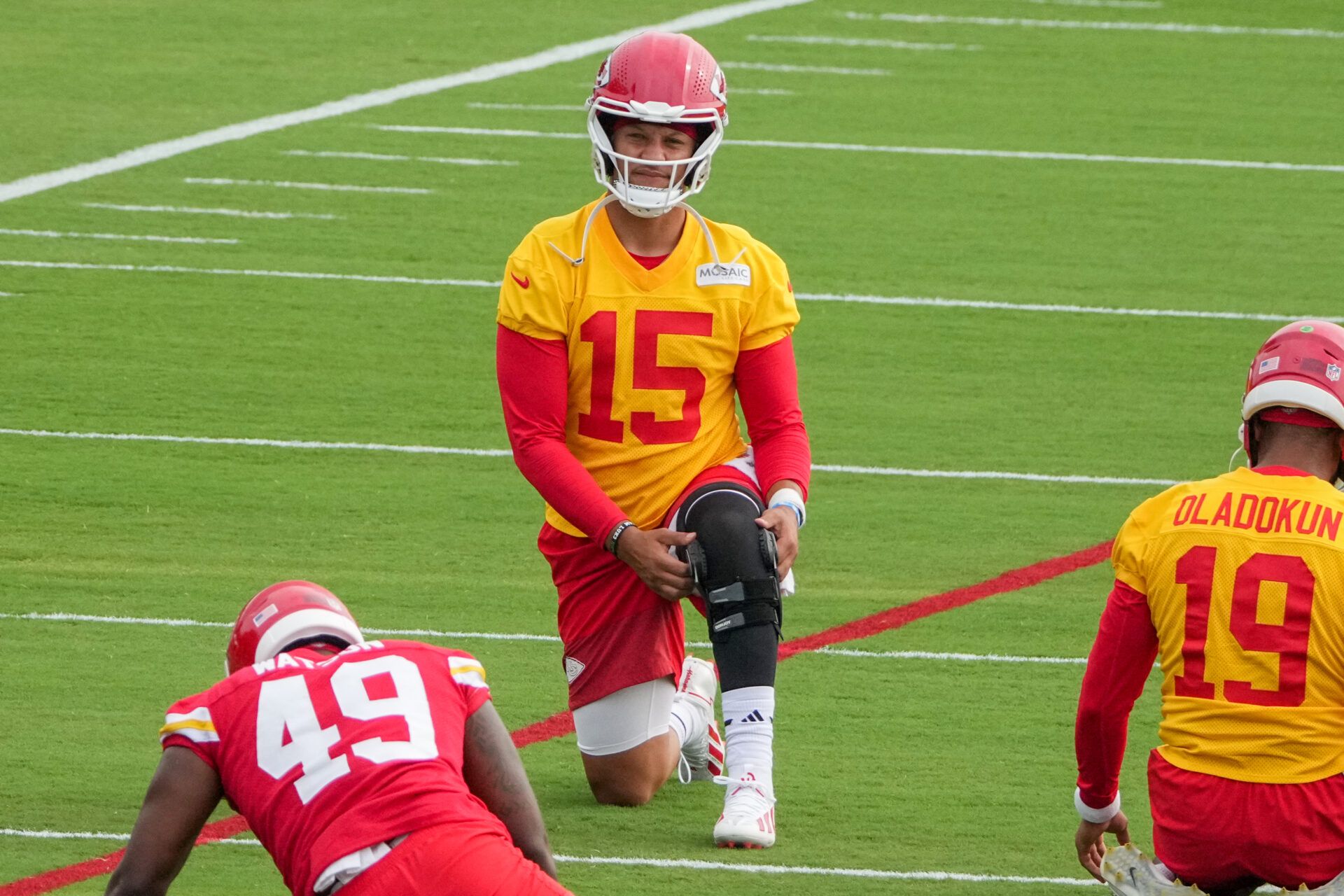 Kansas City Chiefs quarterback Patrick Mahomes (15) adjusts his knee brace during training camp at Missouri Western State University.