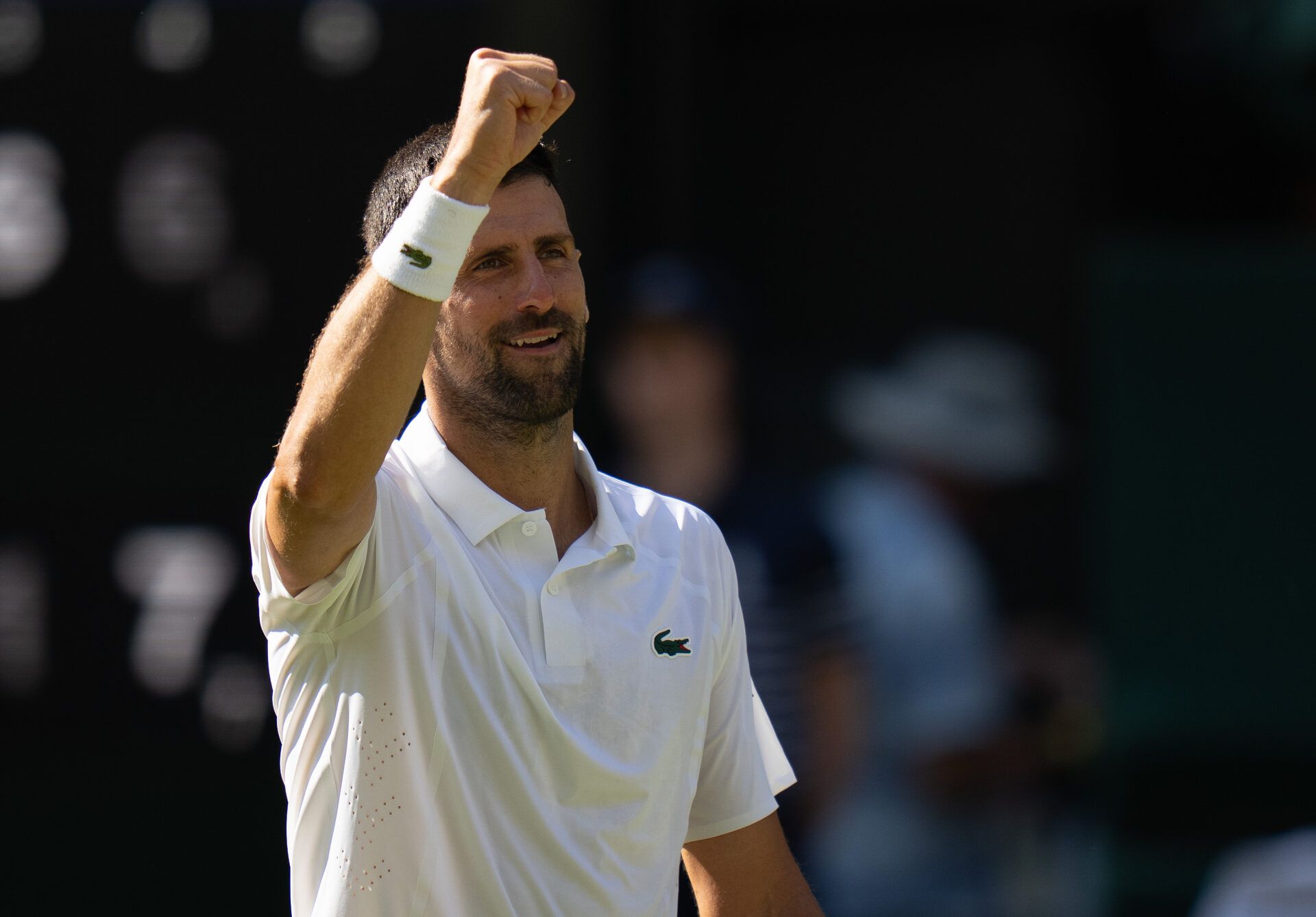 Novak Djokovic of Serbia celebrates winning his match against Arthur Rinderknech of France on day five at All England Lawn Tennis and Croquet Club.