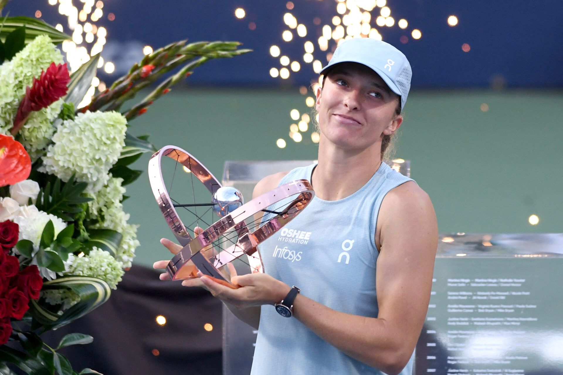 Iga Swiatek (POL) holds the trophy after defeating Elena Rybakina (KAZ) during final round play at Sobeys Stadium.