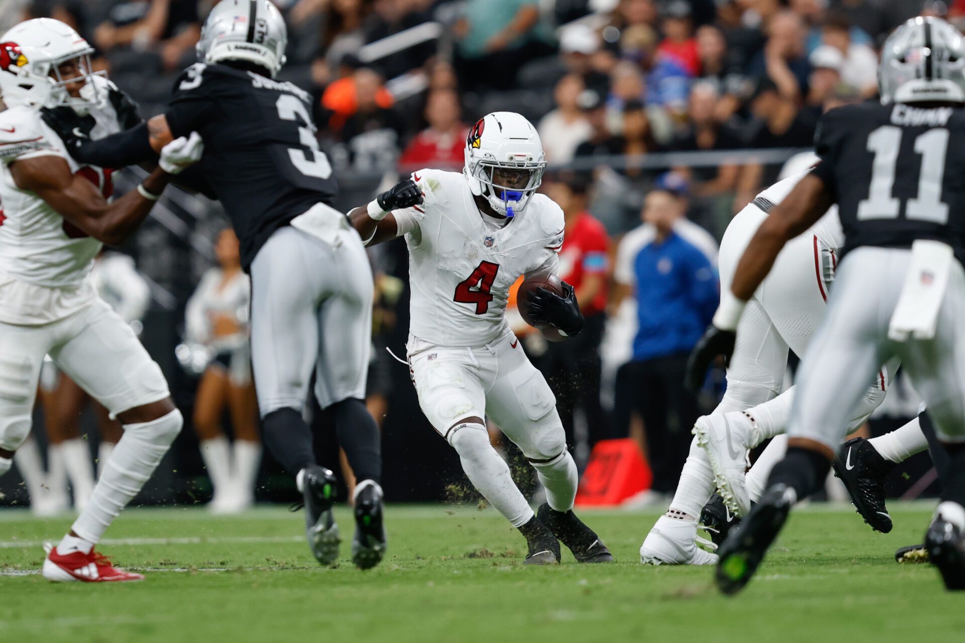 Arizona Cardinals running back Jeremiyah Love (4) runs during a preseason game against the Las Vegas Raiders at Allegiant Stadium.