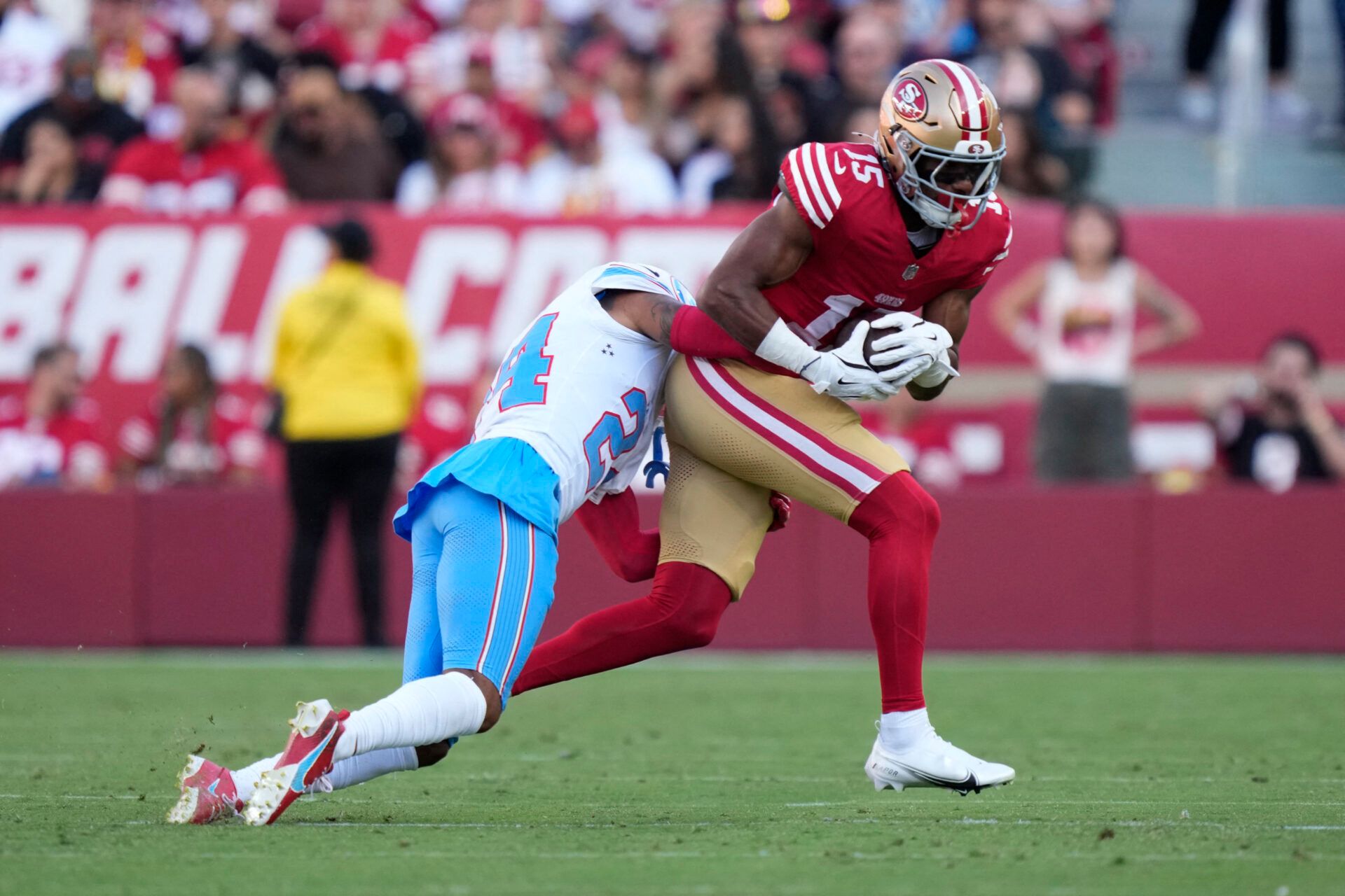San Francisco 49ers wide receiver De'zhaun Stribling (15) is tackled by Tennessee Titans cornerback Alontae Taylor (24) during the first quarter at Levi's Stadium.