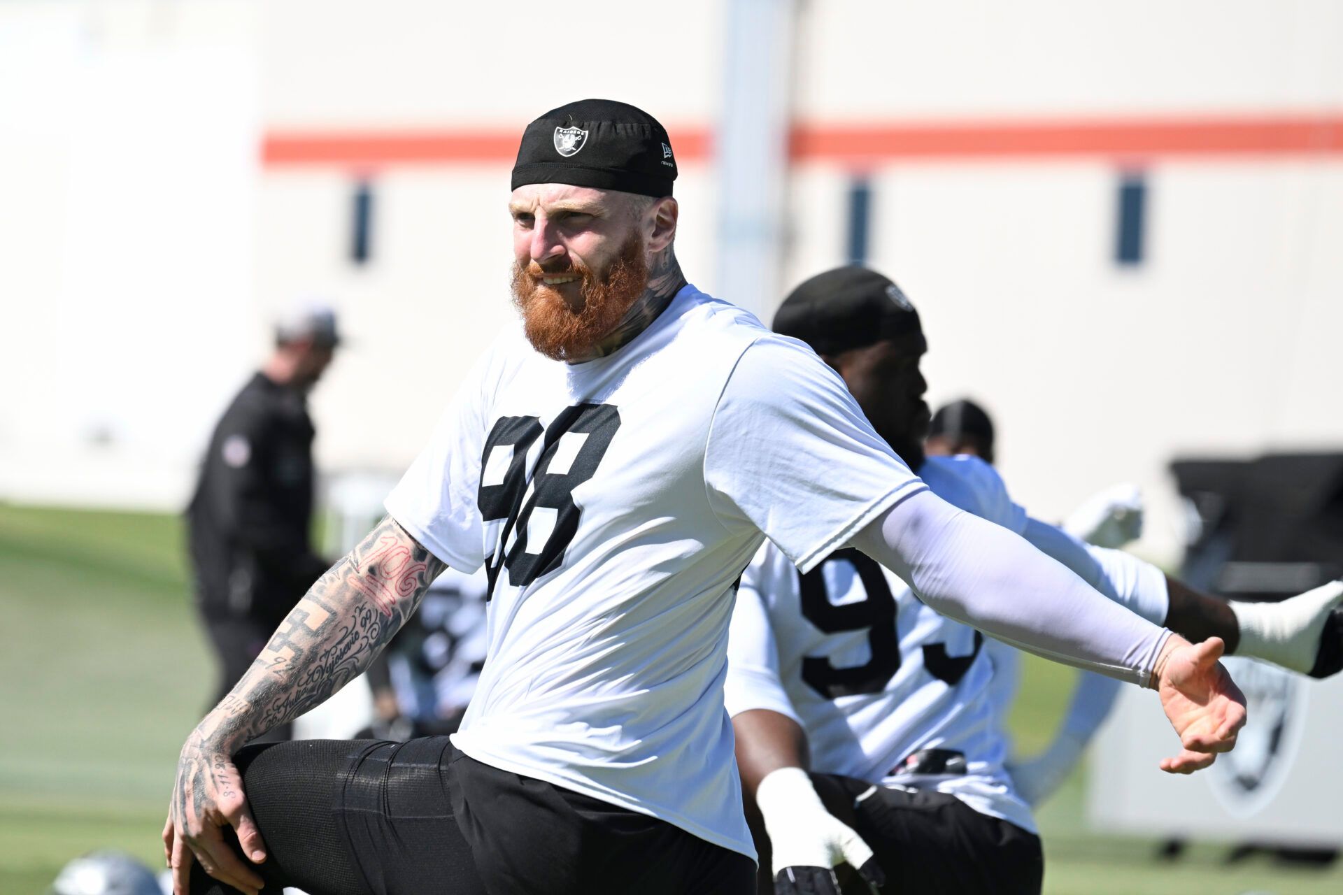 Las Vegas Raiders defensive end Maxx Crosby (98) stretches during organized team activities at Intermountain Health Performance Center.