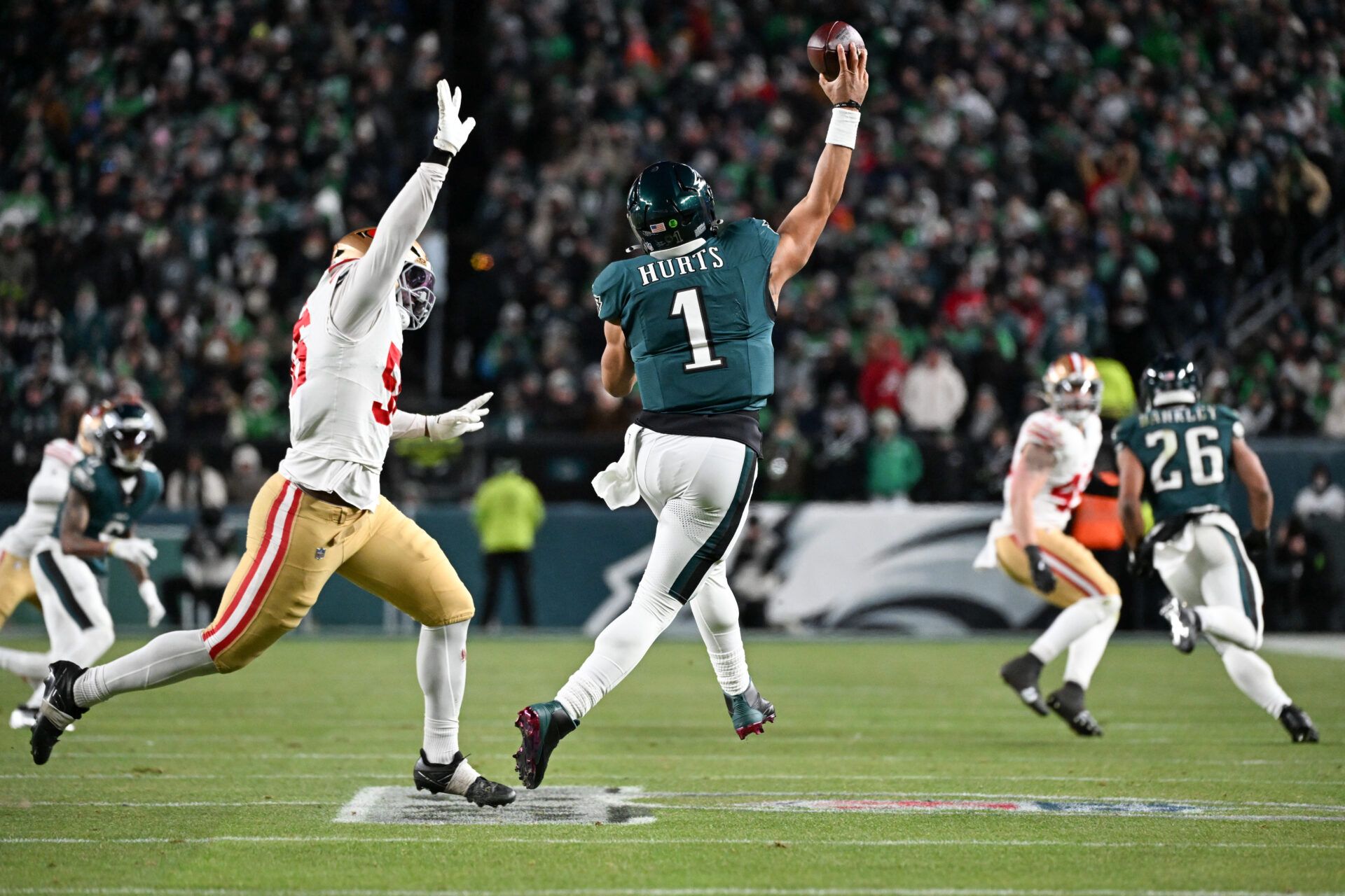 Philadelphia Eagles quarterback Jalen Hurts (1) passes the ball under pressure from San Francisco 49ers defensive tackle Sebastian Valdez (55) during the fourth quarter in an NFC Wild Card Round game at Lincoln Financial Field.