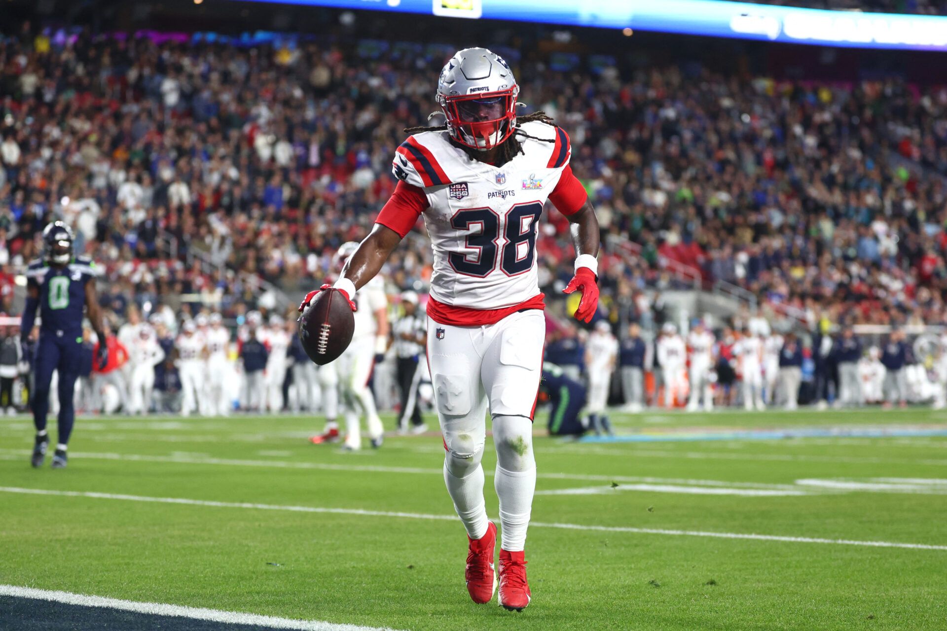 New England Patriots running back Rhamondre Stevenson (38) scores a touchdown against the Seattle Seahawks during the fourth quarter in Super Bowl LX at Levi's Stadium.