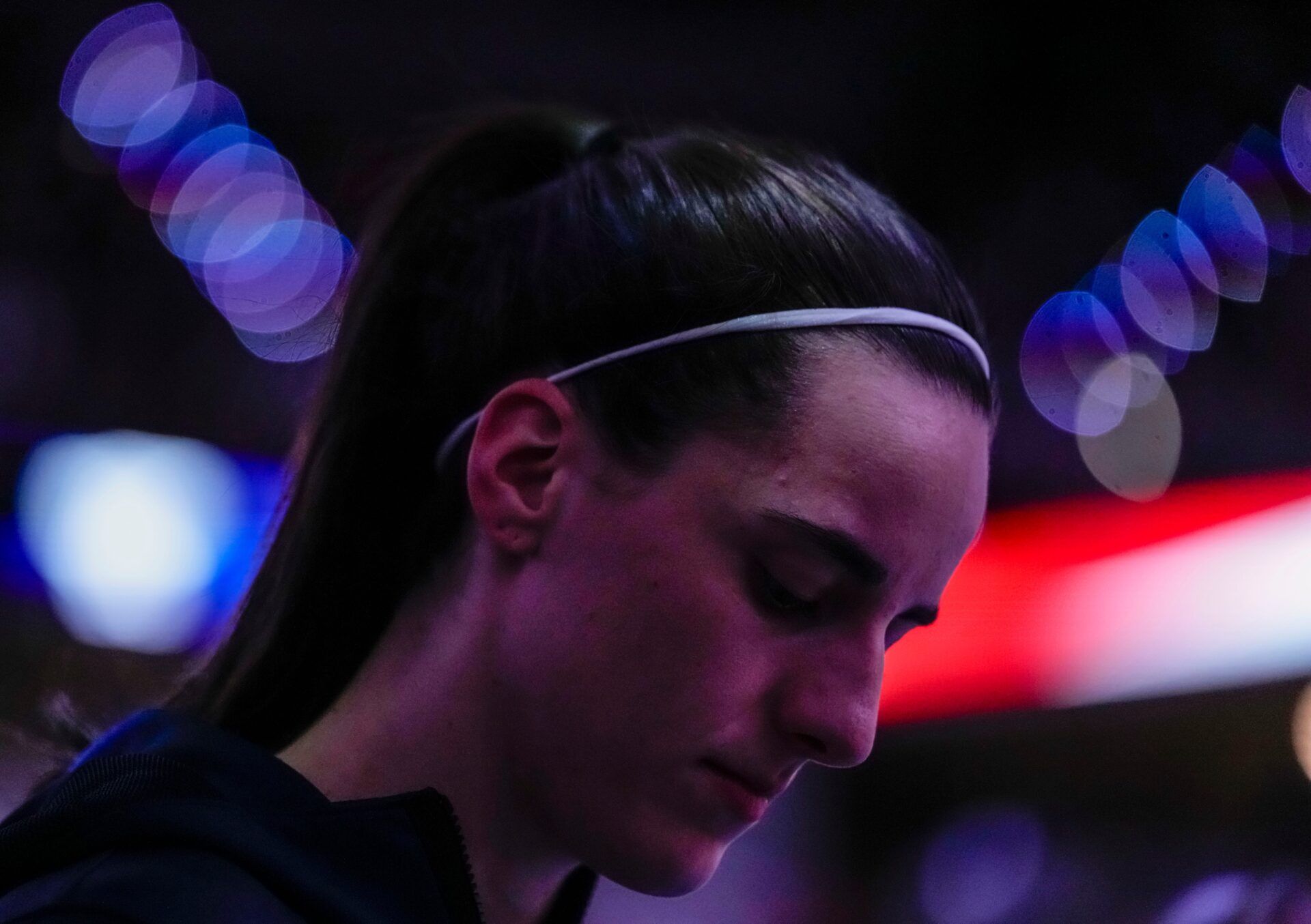 Indiana Fever guard Caitlin Clark (22) bows her head during the national anthem on Tuesday, Aug. 11, 2026, during the game at Gainbridge Fieldhouse in Indianapolis.
