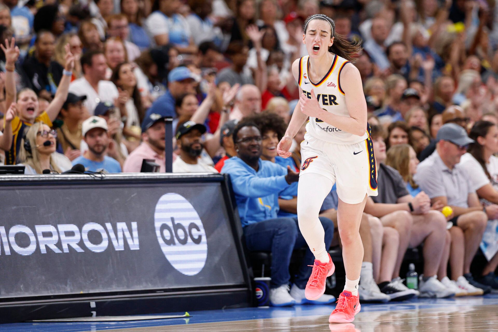 Indiana Fever guard Caitlin Clark (22) reacts after shooting and scoring against Chicago Sky guard Jacy Sheldon during the second half at United Center.
