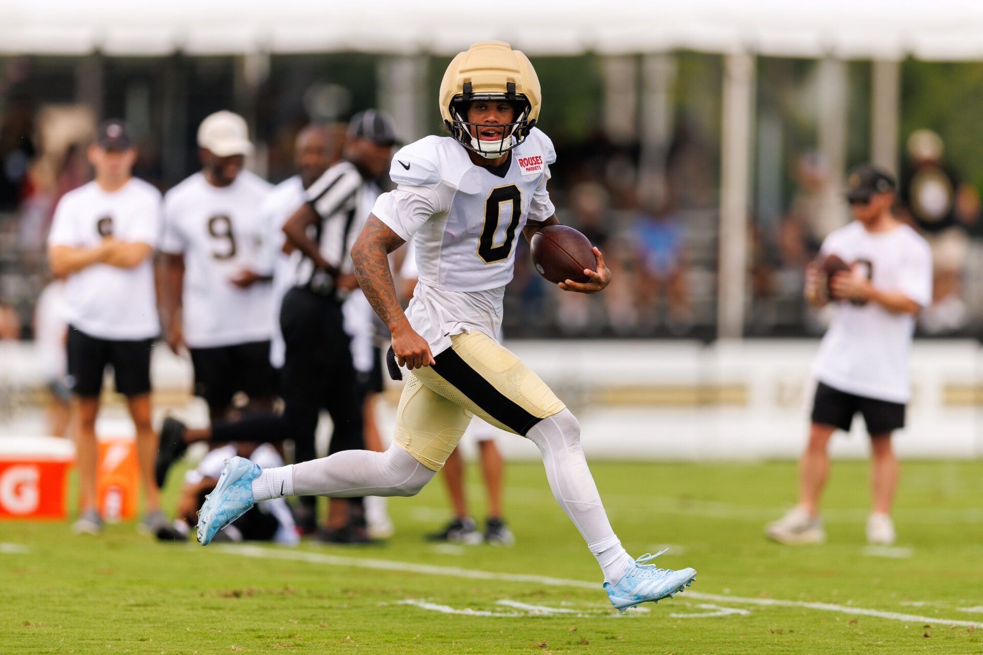 New Orleans Saints wide receiver Jordyn Tyson (0) catches a pass against linebacker Kaden Elliss (55) during training camp at Ochsner Sports Performance Center.