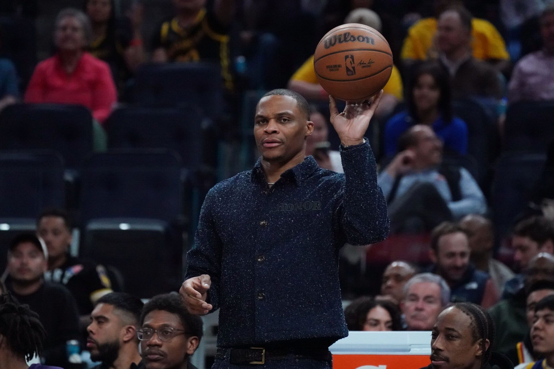Sacramento Kings guard Russell Westbrook (18) catches a ball while sitting on the bench during a game against the Golden State Warriors in the fourth quarter at Chase Center.