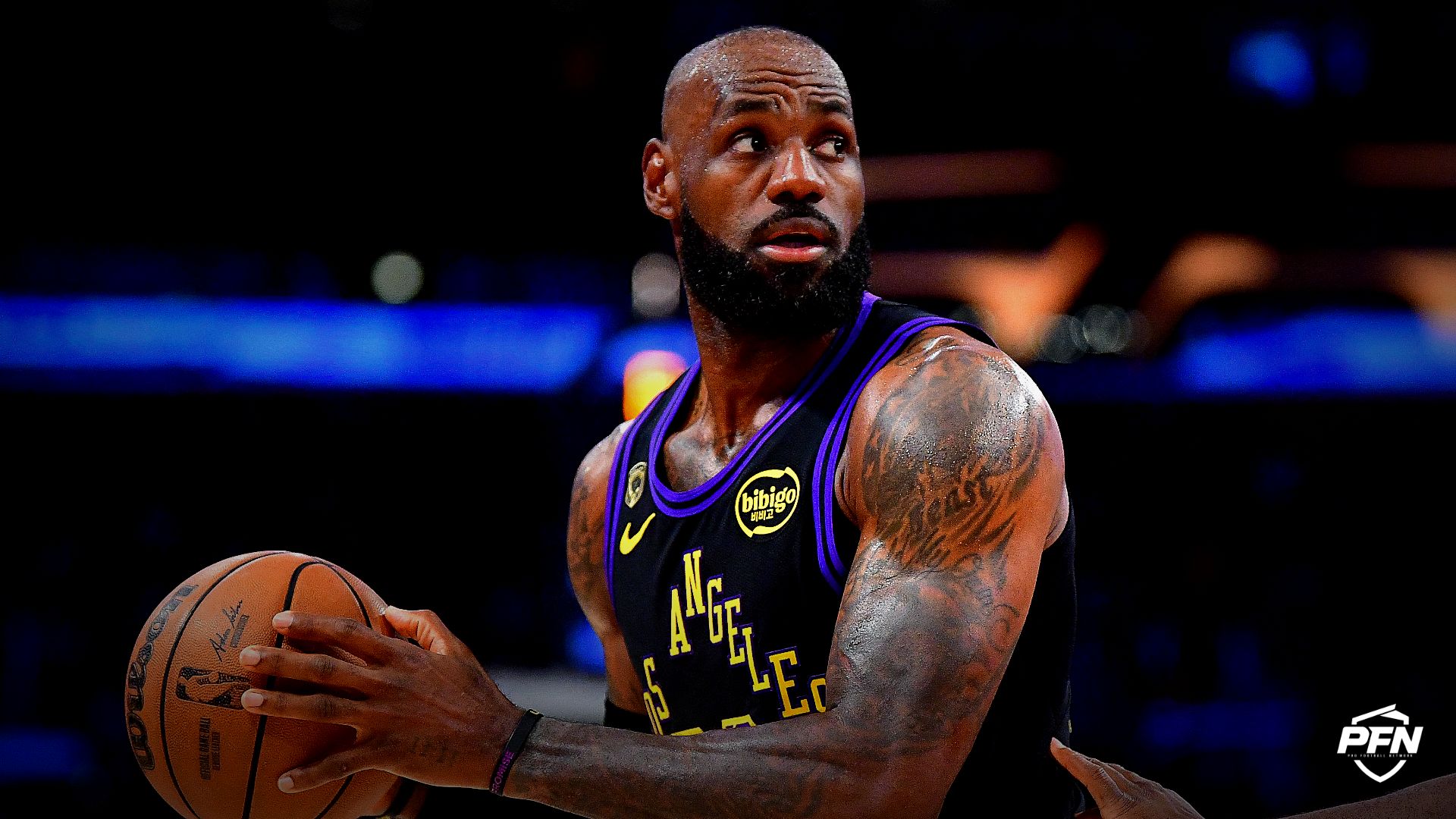 Los Angeles Lakers forward LeBron James (23) controls the ball against Oklahoma City Thunder guard Luguentz Dort (5) during the first half in game four of the second round of the 2026 NBA Playoffs at Crypto.com Arena.