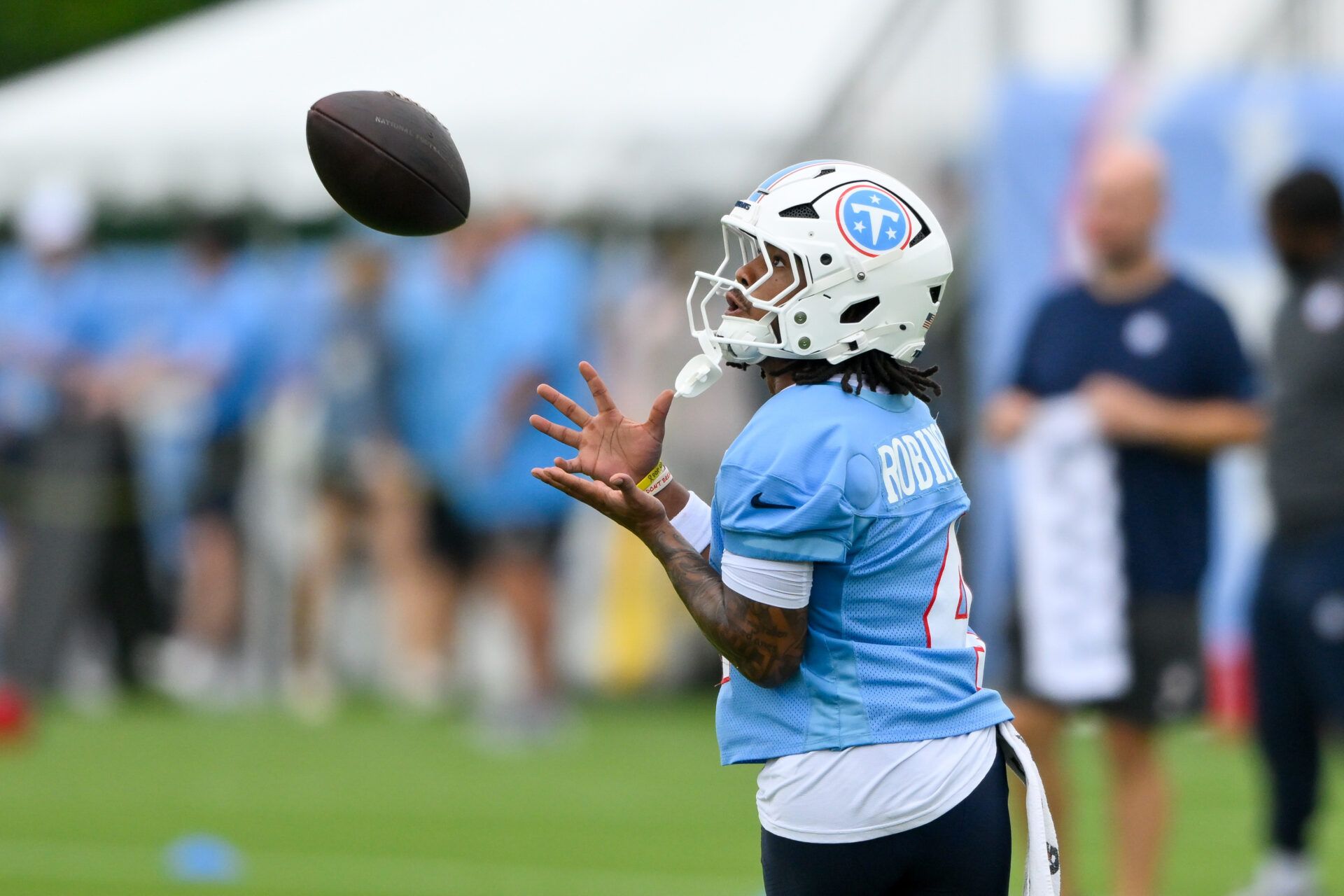 Tennessee Titans wide receiver Wan'Dale Robinson (4) makes a catch during training camp at Vanderbilt Health Football Center.