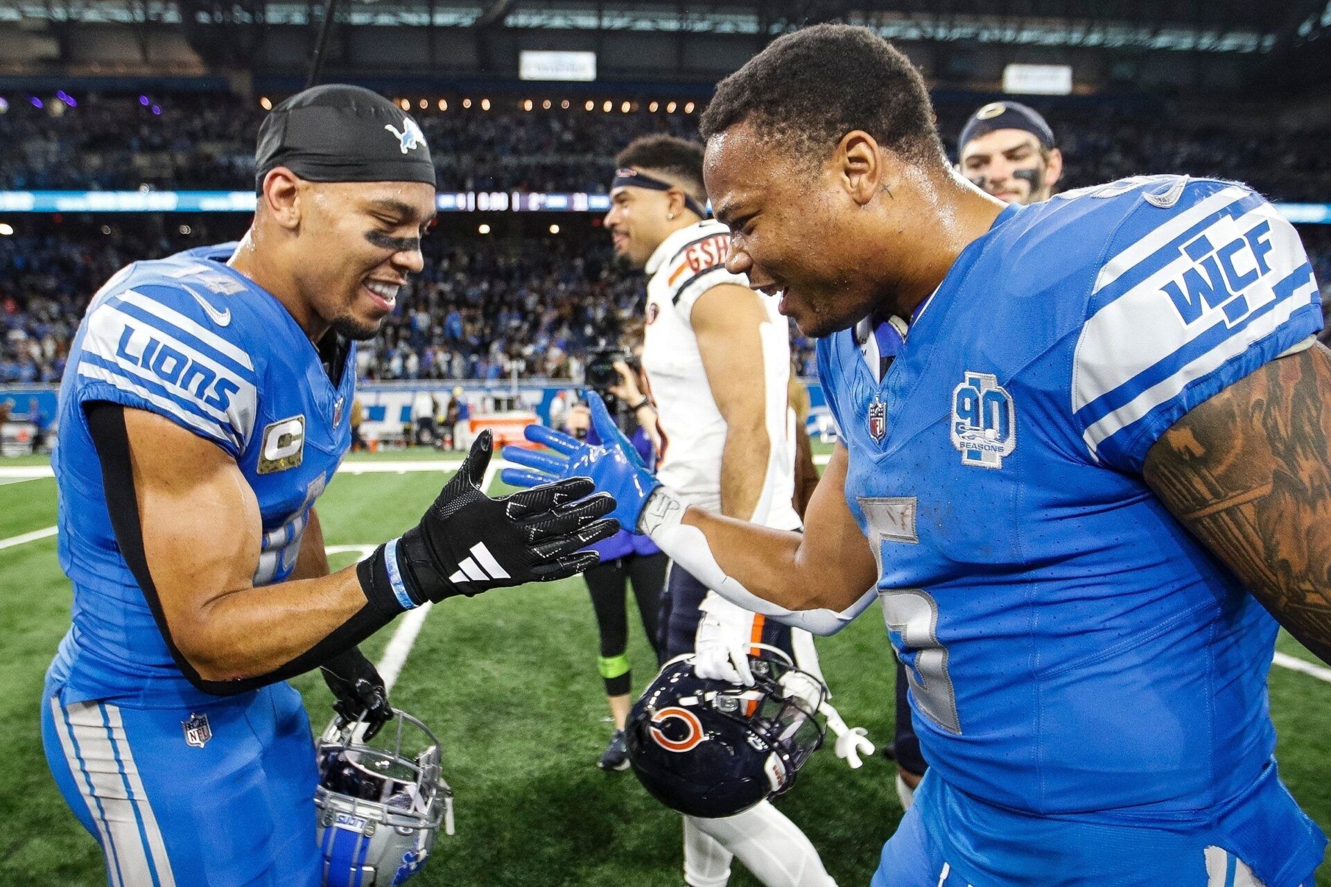 Detroit Lions wide receiver Amon-Ra St. Brown and running back David Montgomery celebrate the 31-26 win over the Chicago Bears at Ford Field in Detroit on Sunday, Nov. 19, 2023.