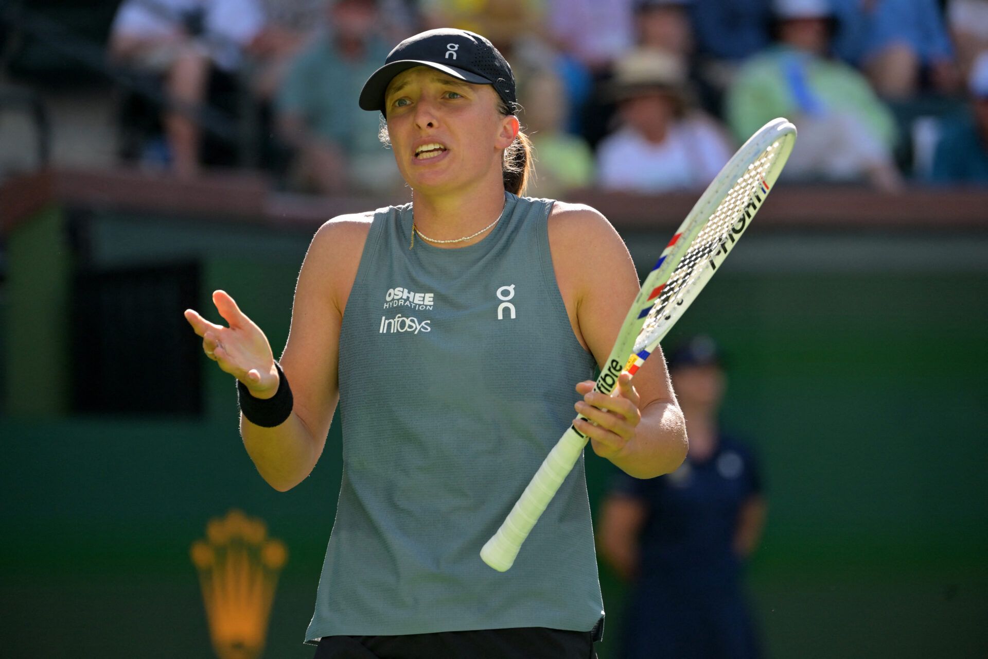 Iga Swiatek (POL) shows some frustration in her quarterfinal against Elina Svitolina (UKR) during the BNP Paribas Open at the Indian Wells Tennis Garden.