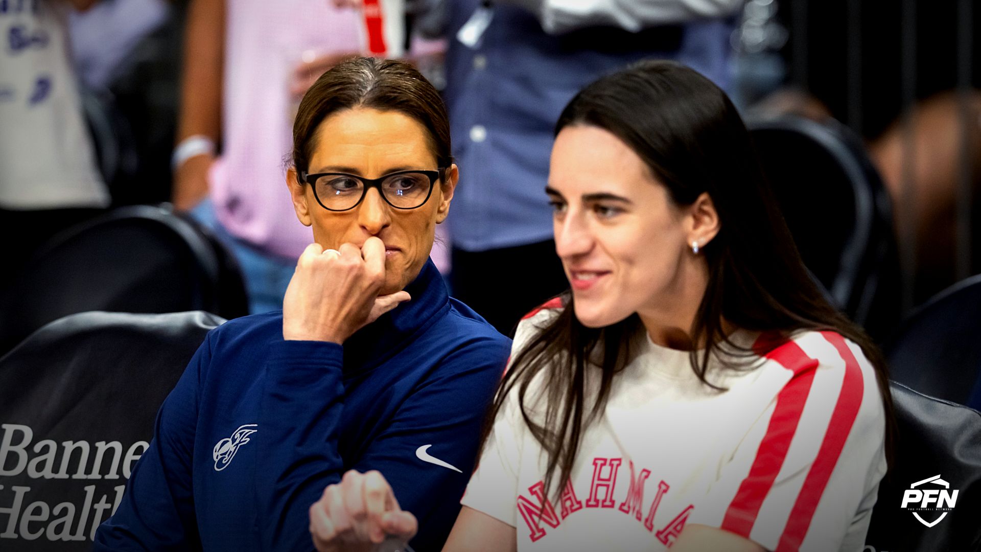 Indiana Fever injured guard Caitlin Clark (right) with head coach Stephanie White against the Phoenix Mercury during an WNBA game at PHX Arena.