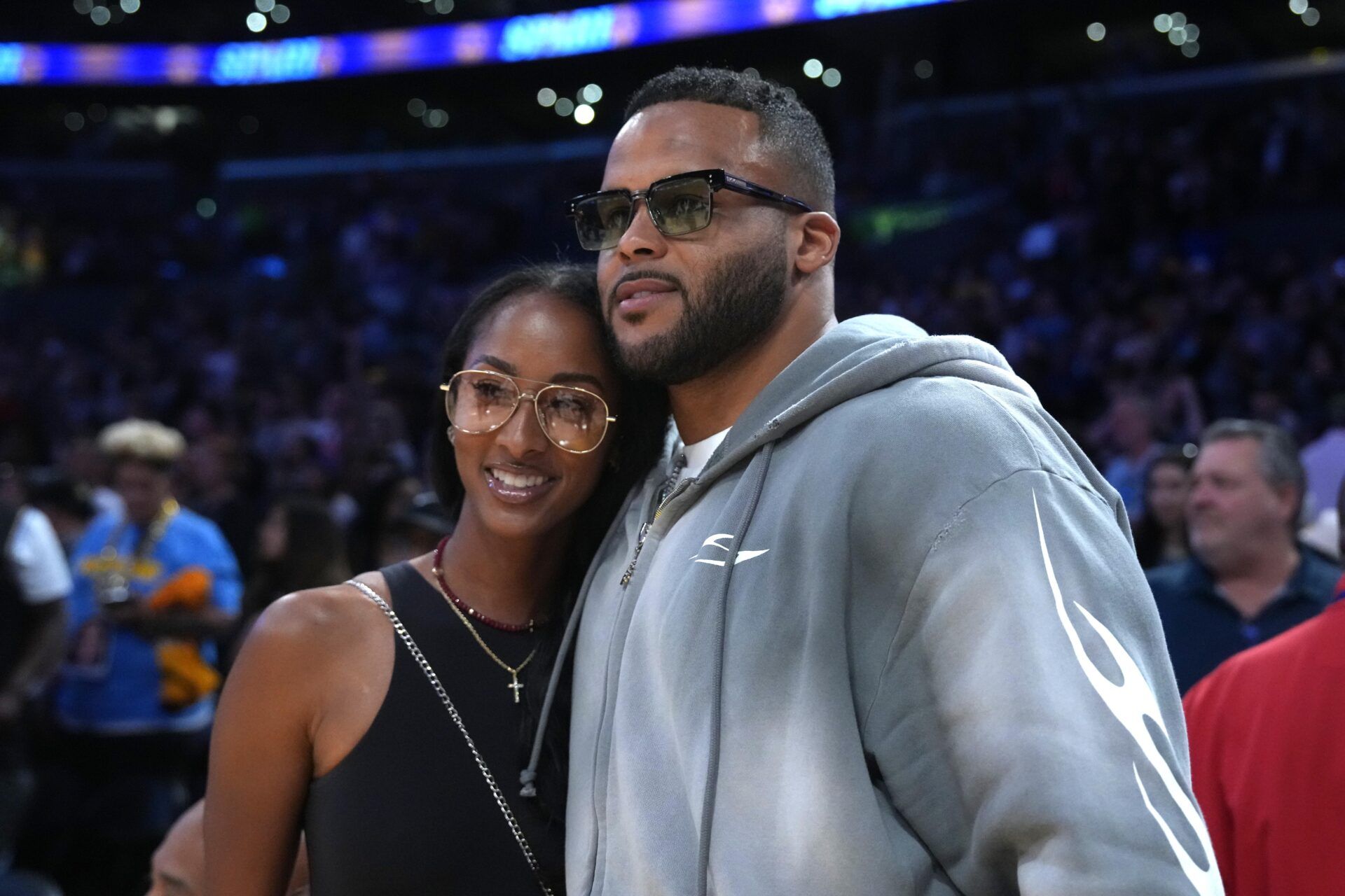 Los Angeles Rams former defensive end Aaron Donald (right) and wife Erica Donald pose during the WNBA game between the Chicago Sky and the LA Sparks at Crypto.com Arena.