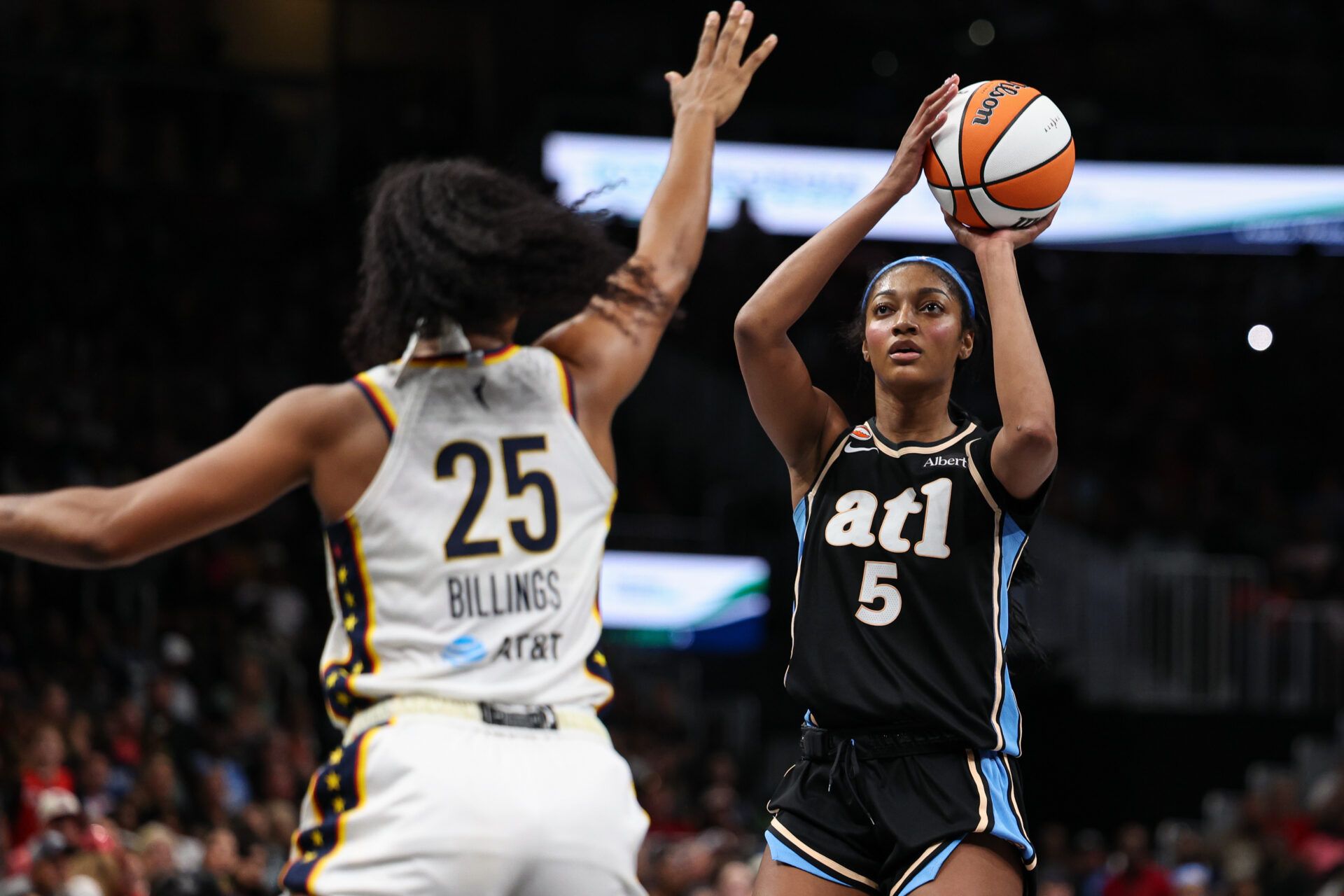 Atlanta Dream forward Angel Reese (5) shoots against Indiana Fever forward Monique Billings (25) during the third quarter at State Farm Arena.