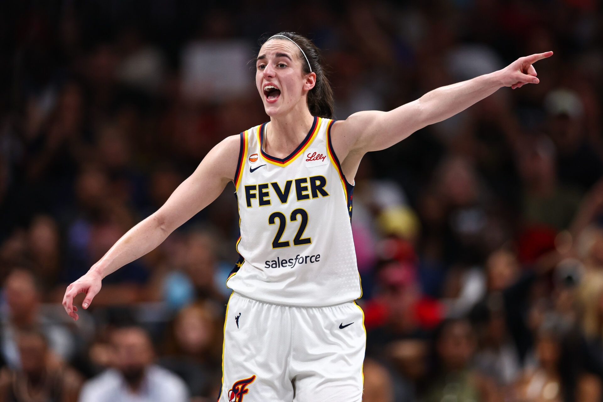Indiana Fever guard Caitlin Clark (22) reacts against the Atlanta Dream during the second quarter at State Farm Arena.