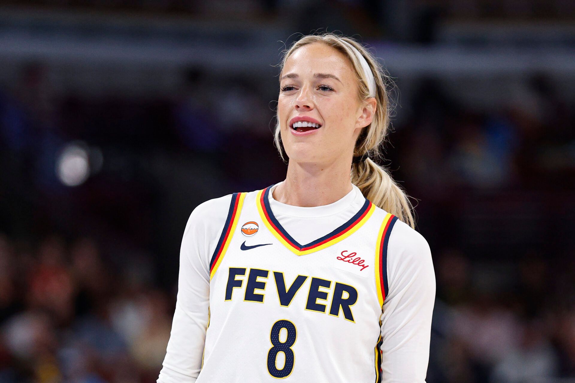 Indiana Fever guard Sophie Cunningham (8) reacts after being fouled by Chicago Sky guard DiJonai Carrington during the first half of a WNBA game at United Center.