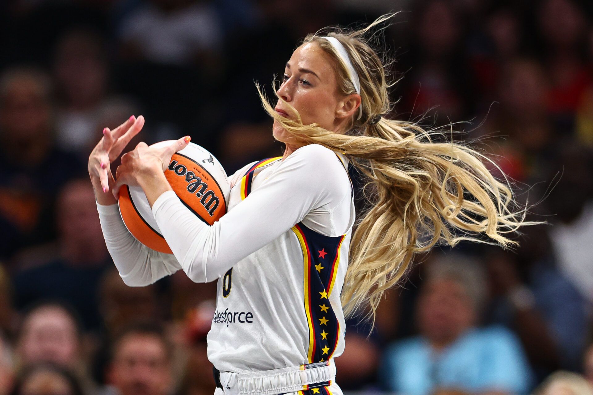 Indiana Fever guard Sophie Cunningham (8) grabs a rebound against the Atlanta Dream during the second quarter at State Farm Arena.