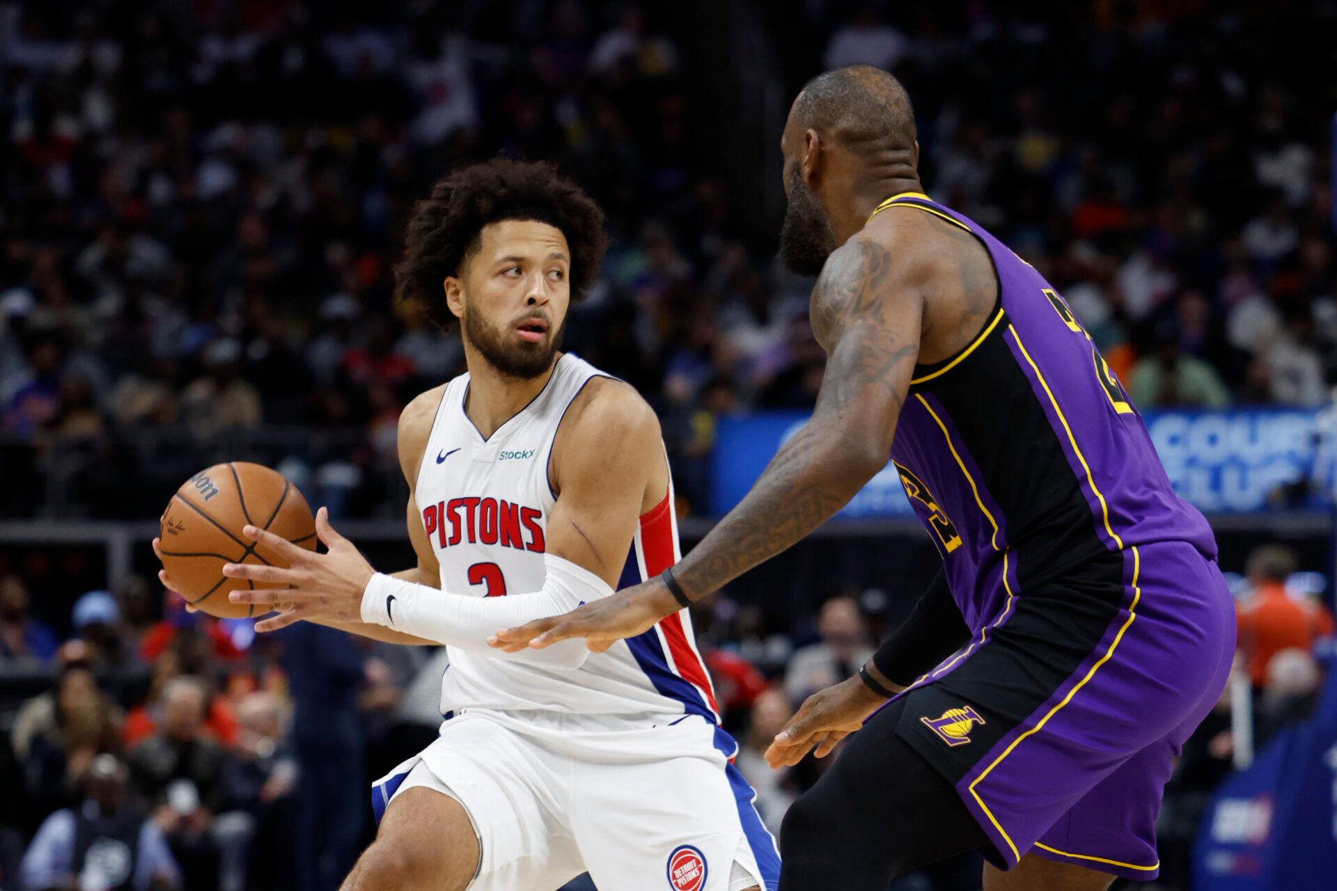 Detroit Pistons guard Cade Cunningham (2) is defended by Los Angeles Lakers forward LeBron James (23) in the second half at Little Caesars Arena.