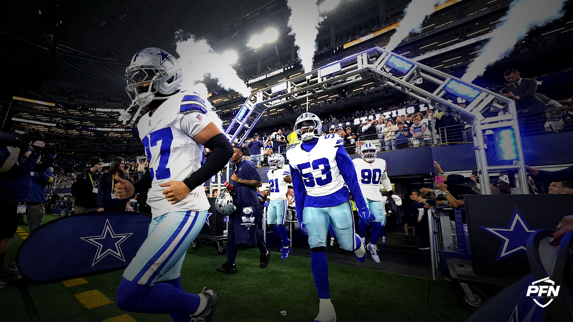 Dallas Cowboys players take the field before a game.
