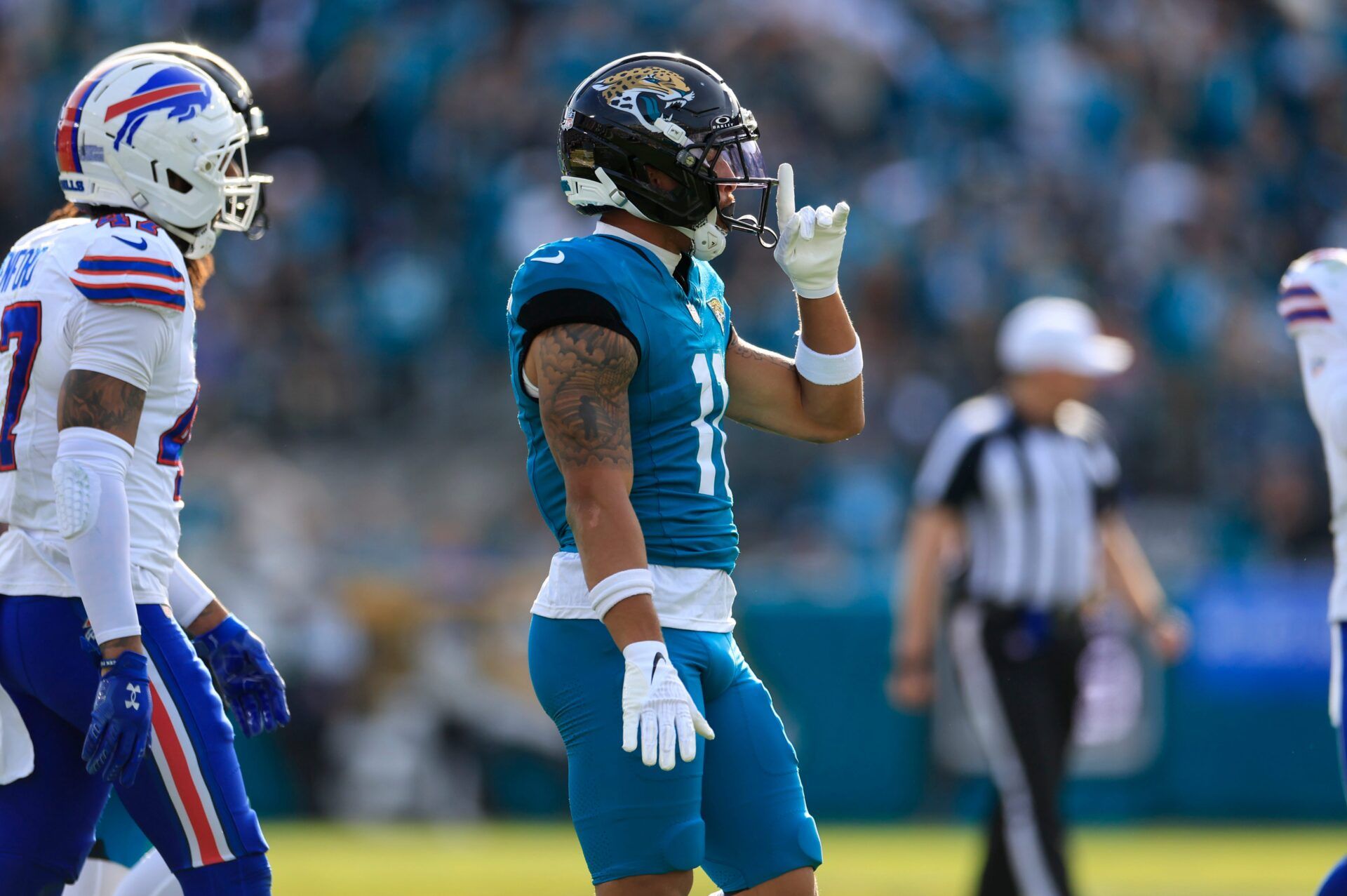 Jacksonville Jaguars wide receiver Parker Washington (11) reacts to his first down pickup during the third quarter of an NFL football AFC Wild Card playoff matchup, Sunday, Jan. 11, 2026, in Jacksonville, Fla. The Bills defeated the Jaguars 27-24. [Corey Perrine/Florida Times-Union]