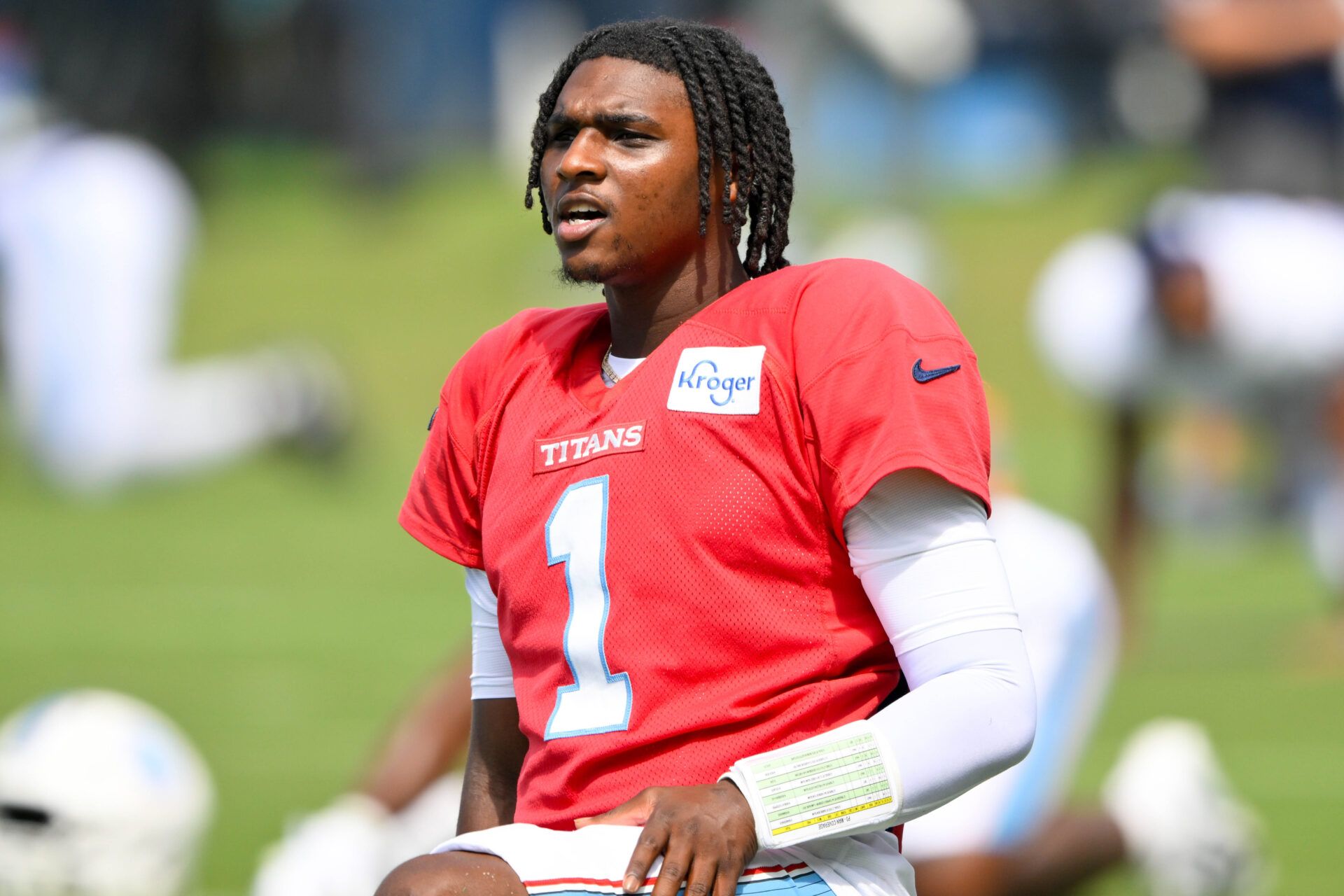 Tennessee Titans quarterback Cam Ward (1) stretches during training camp at Vanderbilt Health Football Center.