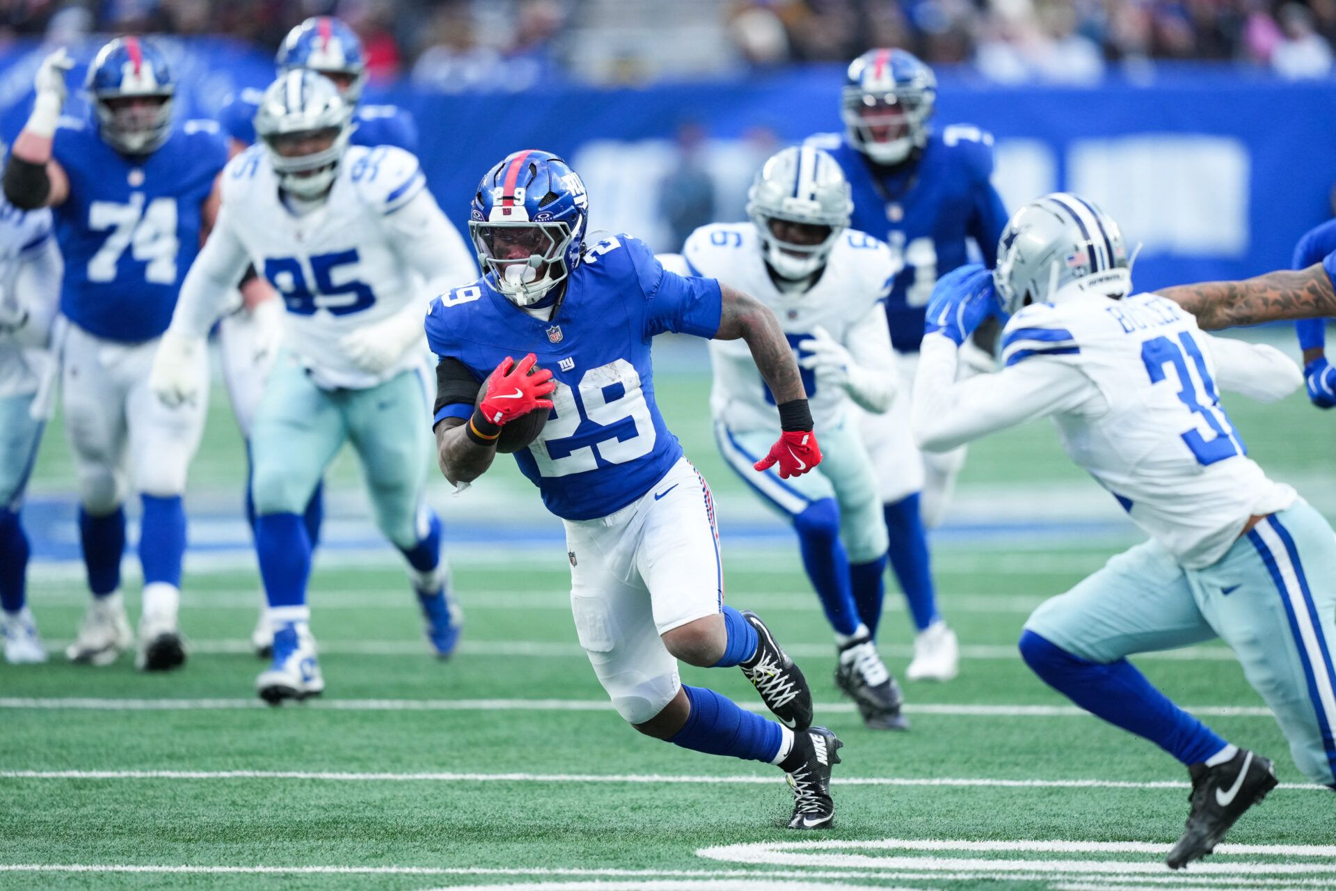 New York Giants running back Tyrone Tracy Jr. (29) rushes during the fourth quarter against the Dallas Cowboys at MetLife Stadium.