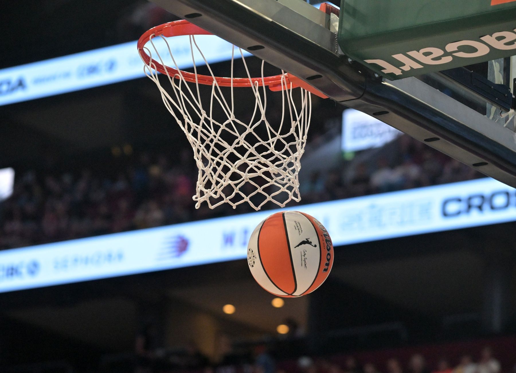 WNBA logo on ball and the net during the first half of the game between the New York Liberty and the Toronto Tempo at the Bell Centre.