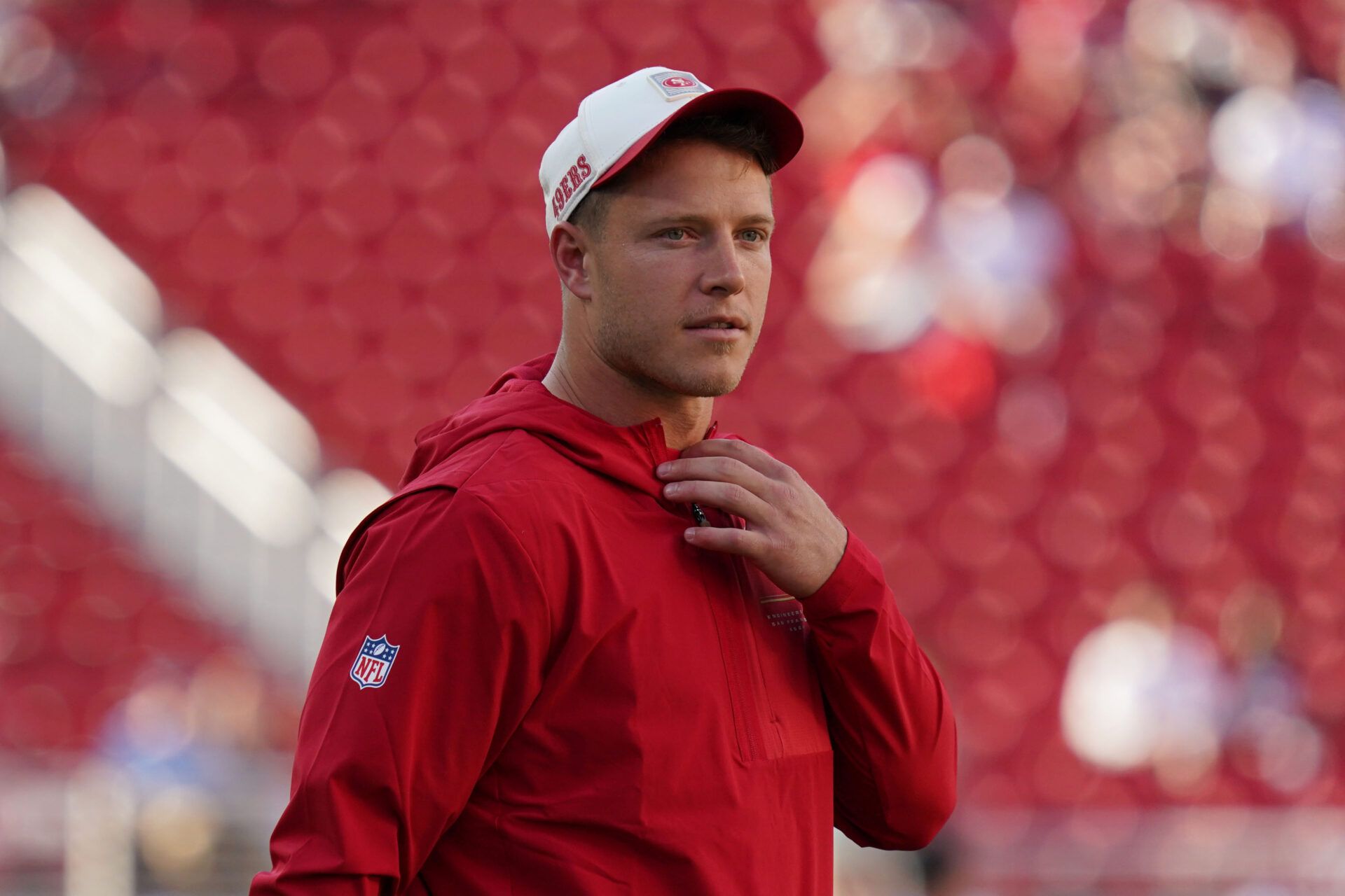 San Francisco 49ers running back Christian McCaffrey (23) watches warmups before a preseason game against the Tennessee Titans at Levi's Stadium.