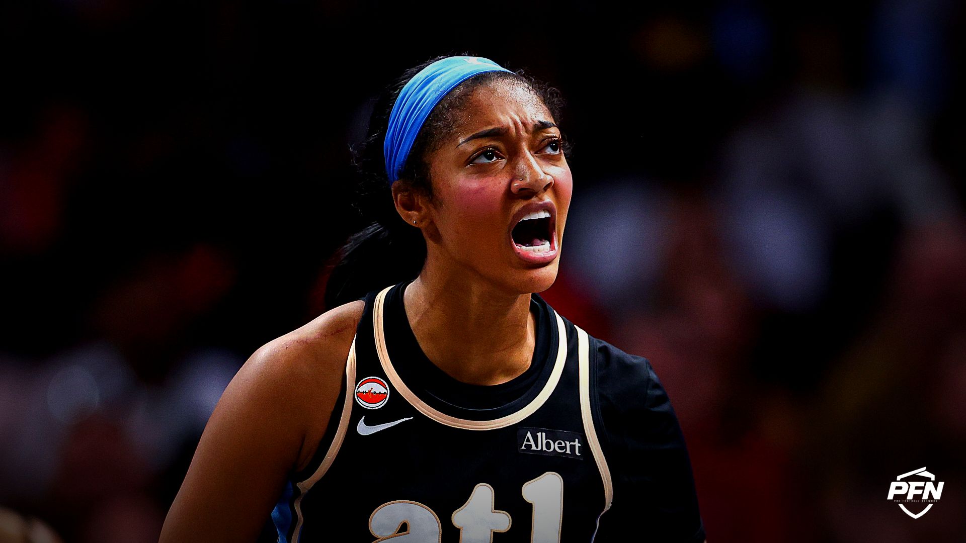 Atlanta Dream forward Angel Reese (5) reacts against the Indiana Fever during the third quarter at State Farm Arena.