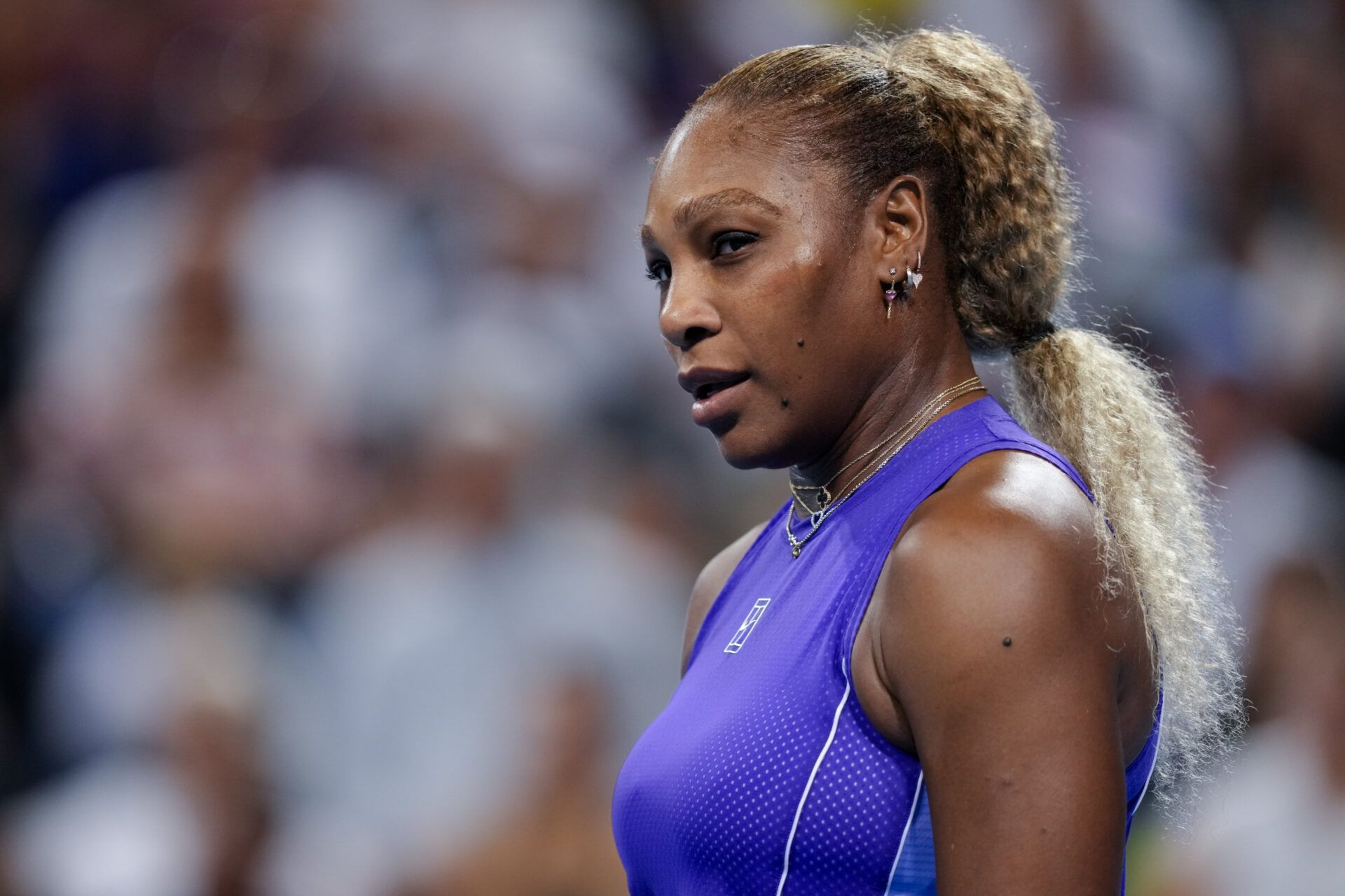 Serena Williams of the United States stands on the court against Marta Kostyuk of Ukraine and Peyton Stearns of the United States in their doubles match during the Cincinnati Open at Lindner Family Tennis Center.