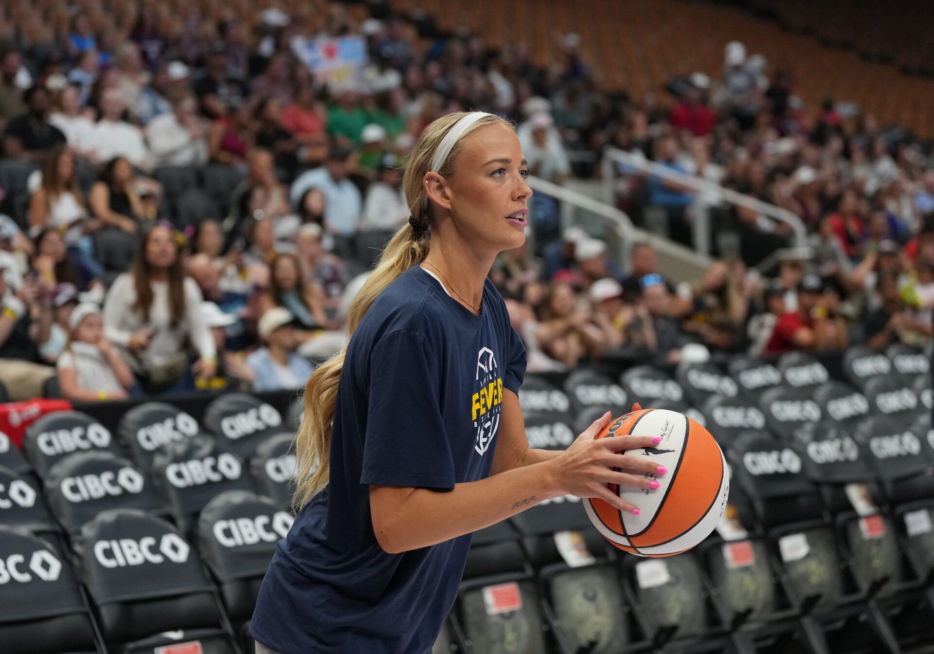 Indiana Fever guard Sophie Cunningham (8) takes jump shots during the warmup before a game against the Toronto Tempo at Scotiabank Arena.