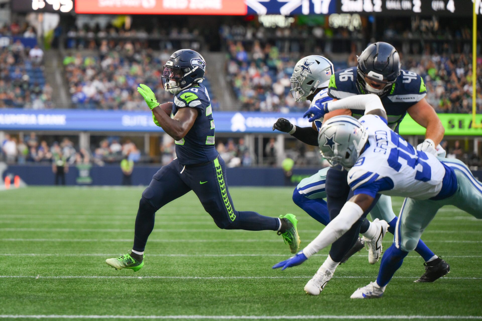 Seattle Seahawks running back TJ Harden (30) carries the ball against the Dallas Cowboys during the game at Lumen Field.