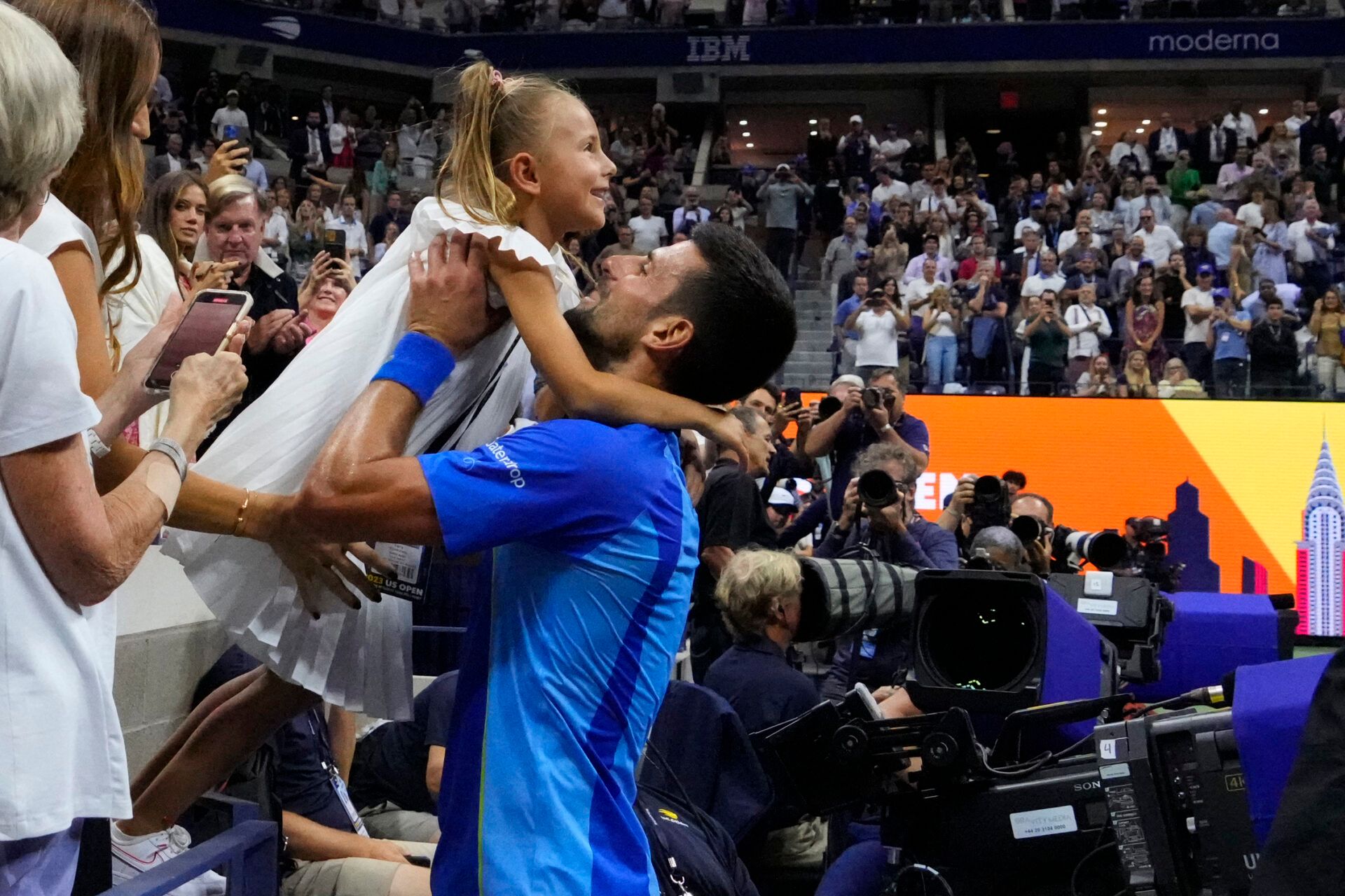 Novak Djokovic of Serbia celebrates with his daughter Tara after his match against Daniil Medvedev (not pictured) in the men's singles final on day fourteen of the 2023 U.S. Open tennis tournament at USTA Billie Jean King National Tennis Center.