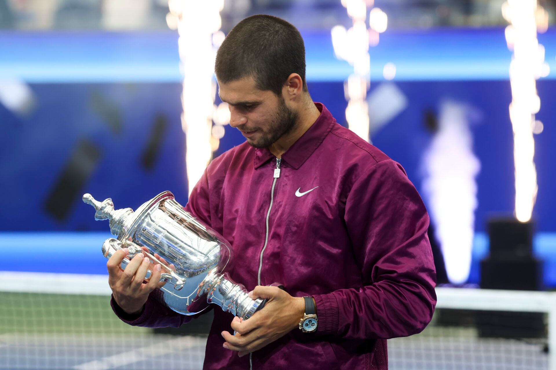 Carlos Alcaraz (ESP) looks at the trophy after winning the final of mens singles at Billie Jean King National Tennis Center.