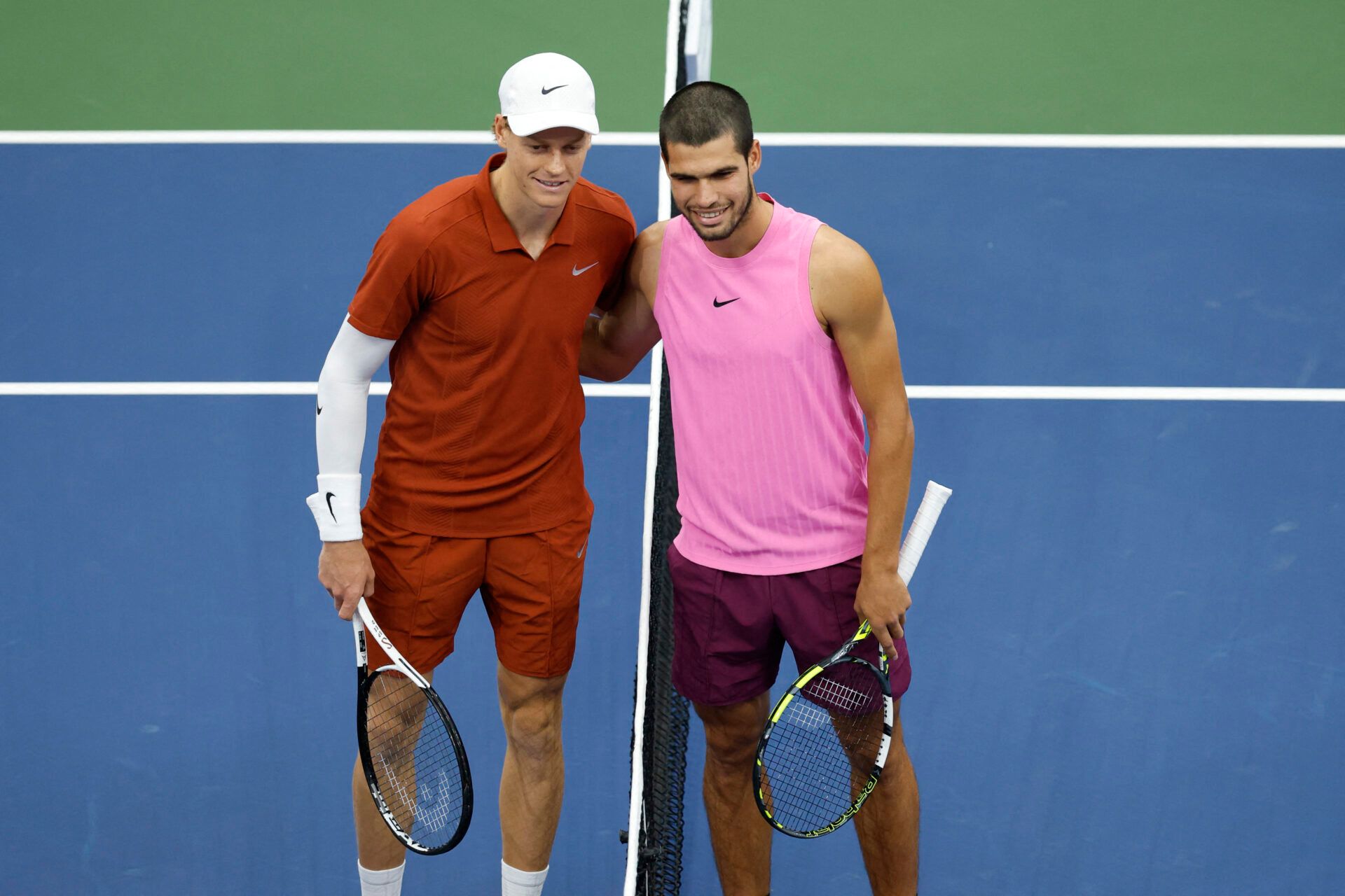 Jannik Sinner (ITA) and Carlos Alcaraz (ESP) pose for a photo at the net prior to the final of mens singles at Billie Jean King National Tennis Center.