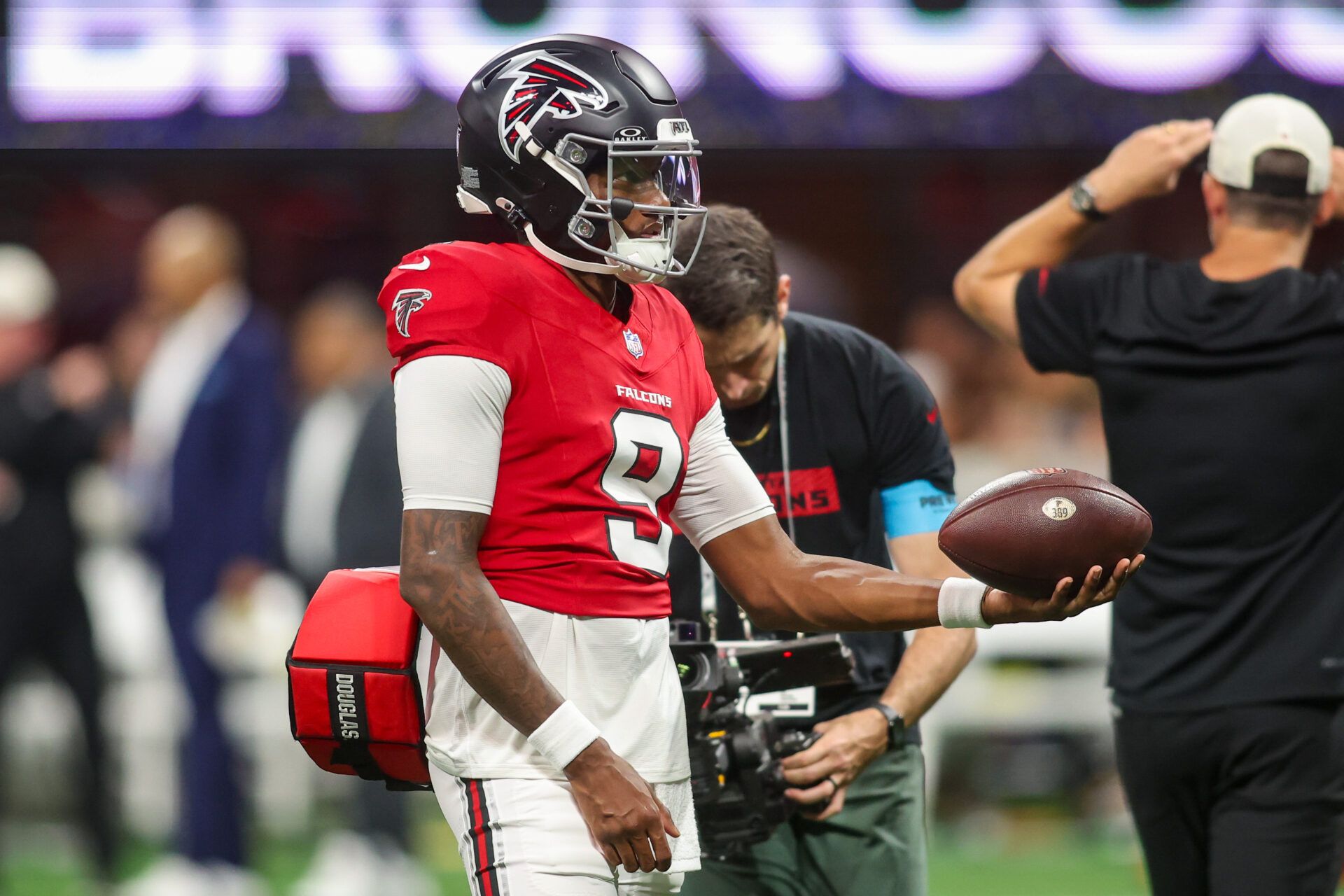 Atlanta Falcons quarterback Michael Penix Jr. (9) warms up before a game against the Denver Broncos at Mercedes-Benz Stadium.
