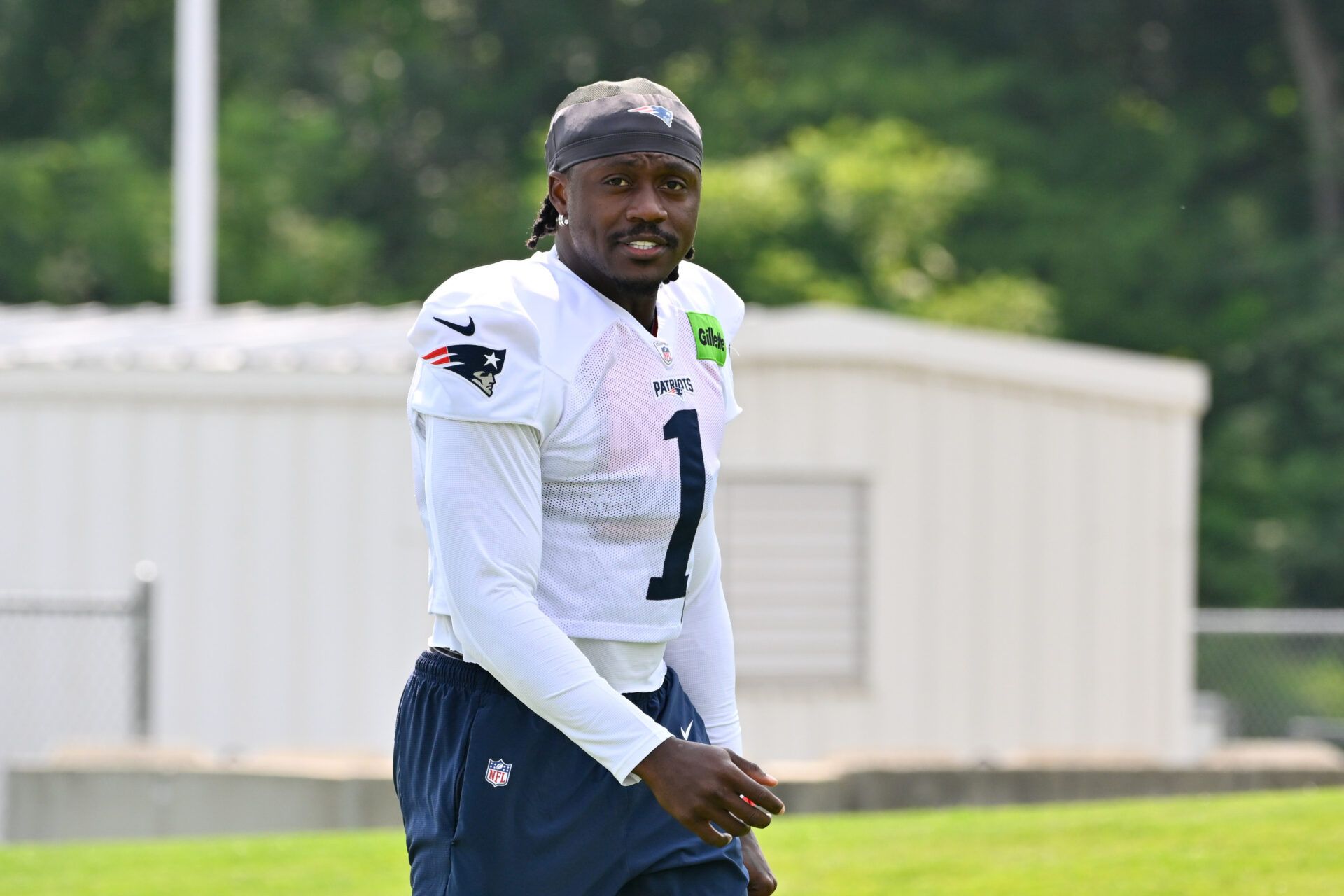 New England Patriots wide receiver A.J. Brown (1) walks to practice for training camp at Gillette Stadium.