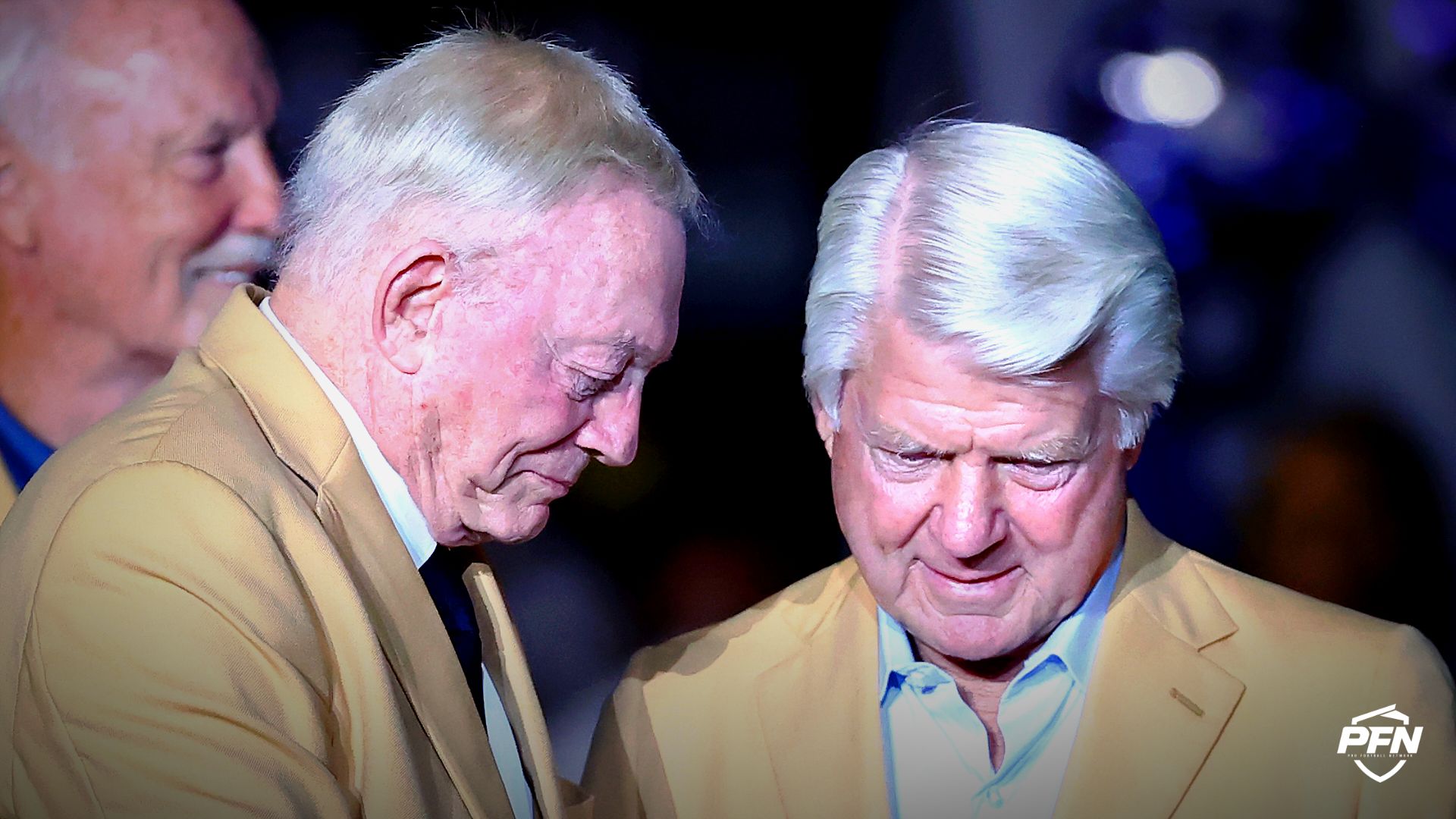 Jerry Jones puts the Hall of Fame ring on the finger of Jimmy Johnson during a presentation at halftime during the game between the Philadelphia Eagles and the Dallas Cowboys at AT&T Stadium.