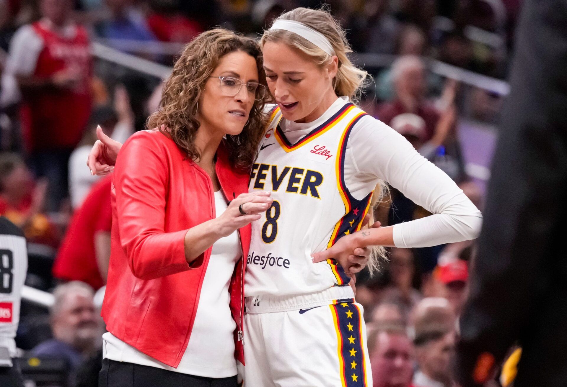 Indiana Fever head coach Stephanie White talks with Indiana Fever guard Sophie Cunningham (8) on Tuesday, Aug. 11, 2026, during the game at Gainbridge Fieldhouse in Indianapolis.