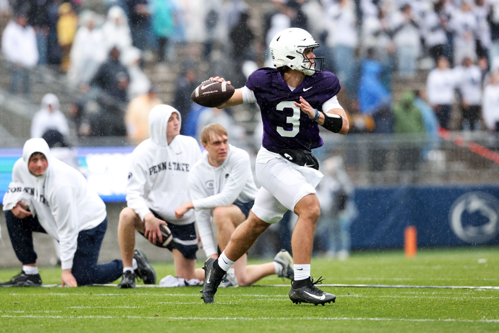 Penn State Nittany Lions quarterback Rocco Becht (3) looks to throw a pass on the run during the Penn State Blue-White Spring game at Beaver Stadium.