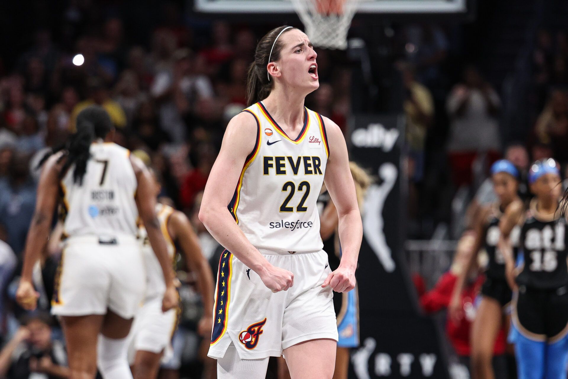 Indiana Fever guard Caitlin Clark (22) reacts against the Atlanta Dream during overtime at State Farm Arena.